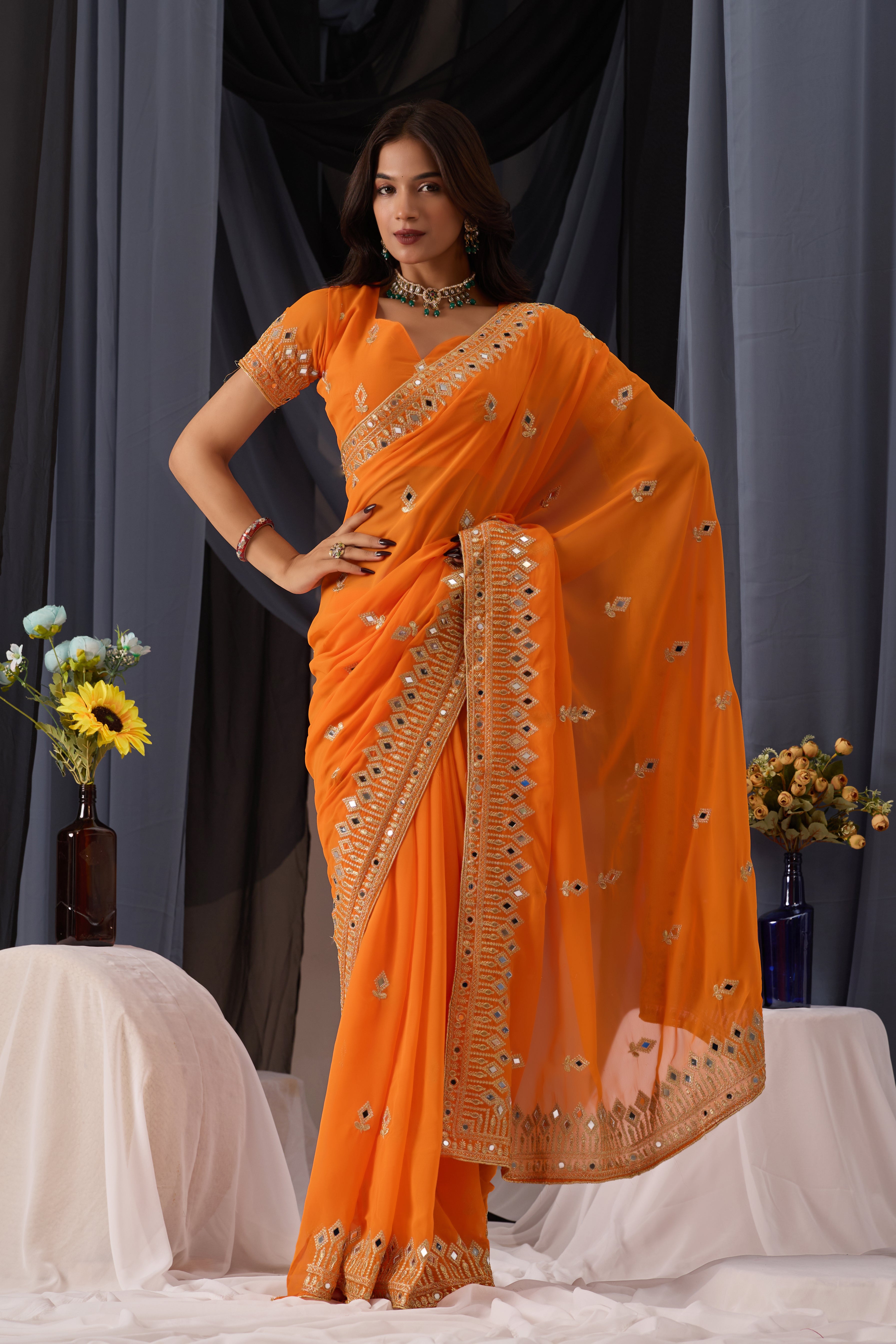 Elegant Orange Georgette Saree with Golden Embroidered Border