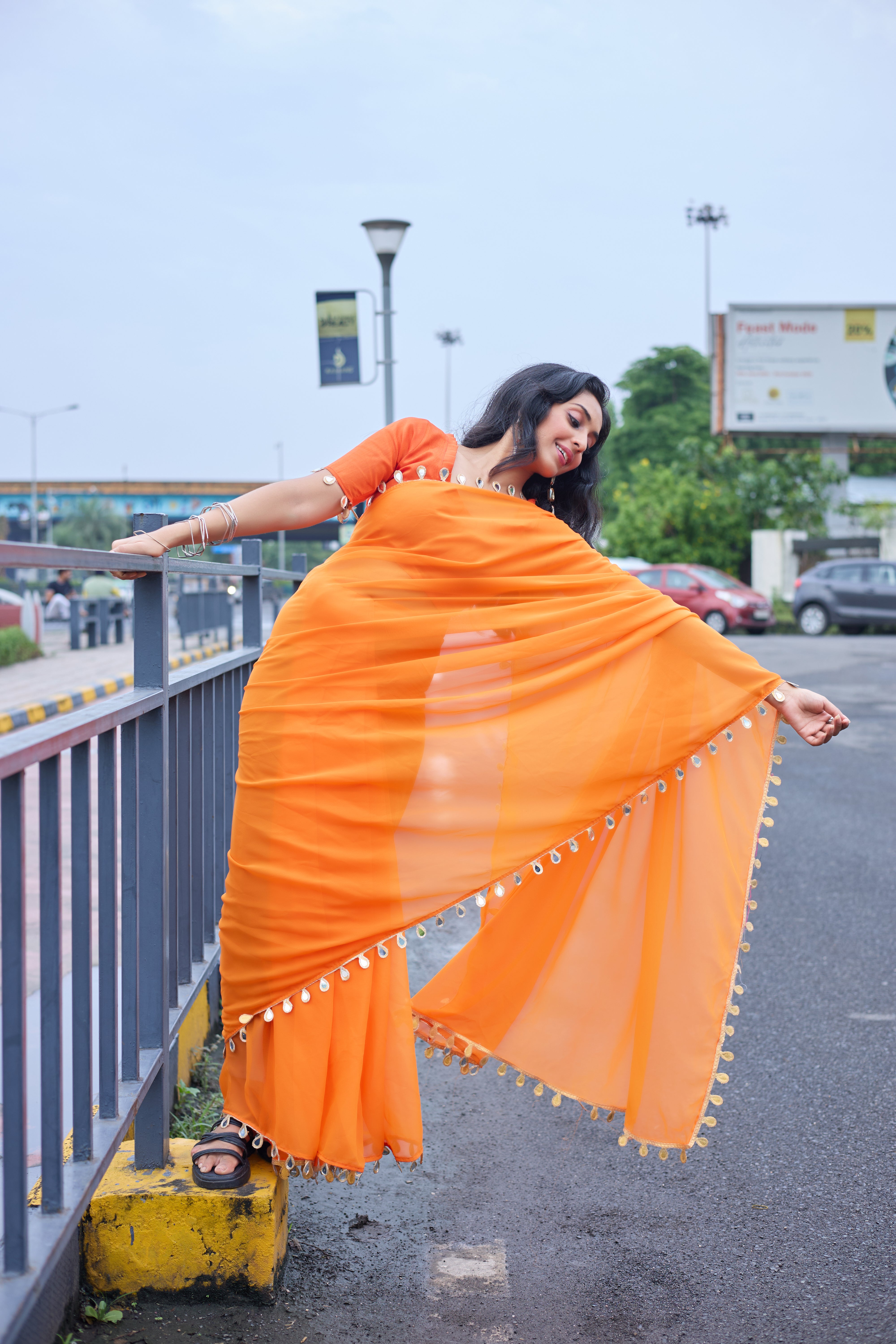 Sunset Glow Orange Saree with Shell Embellishments