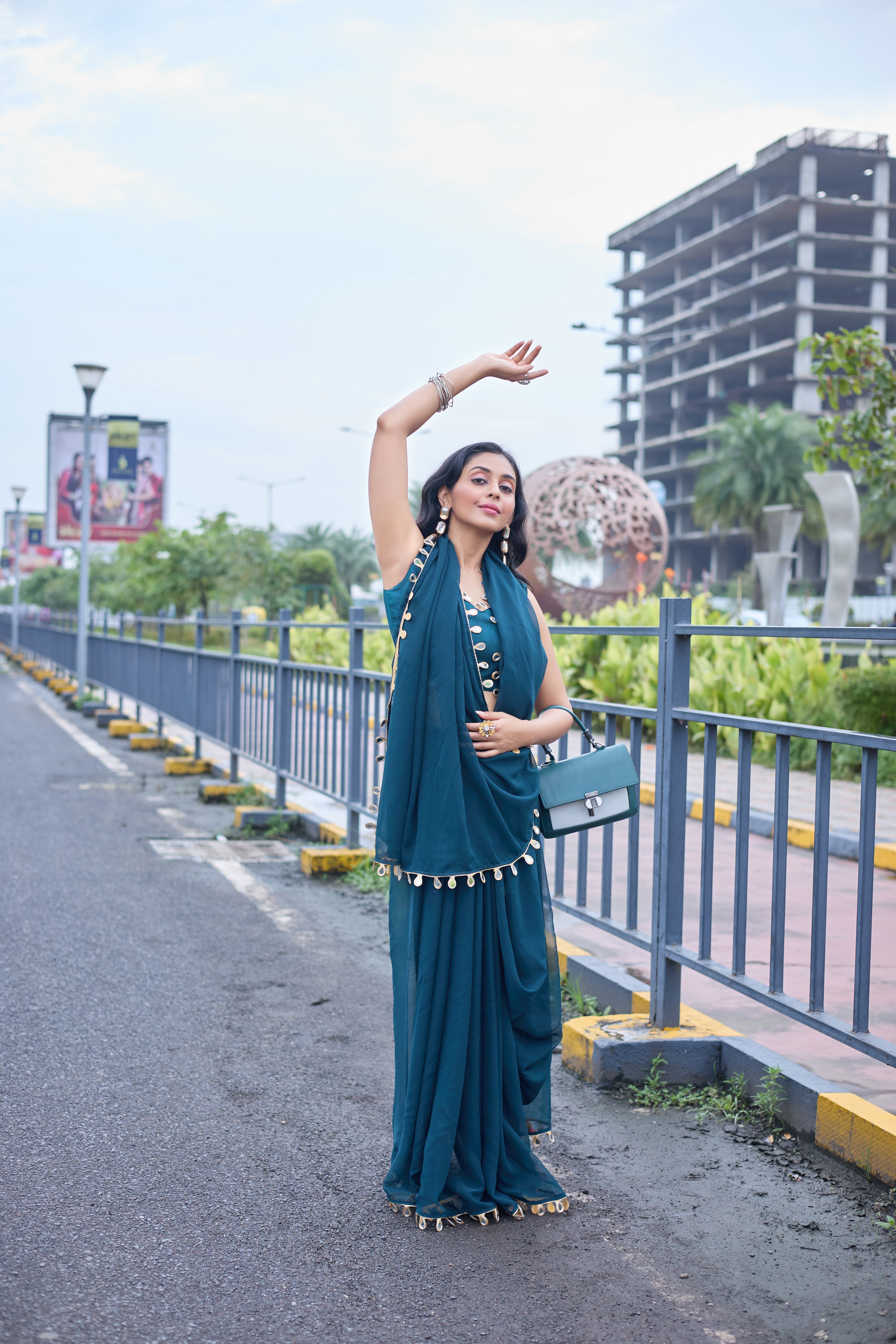 Designer Teal Georgette Saree with Gold Coin Border