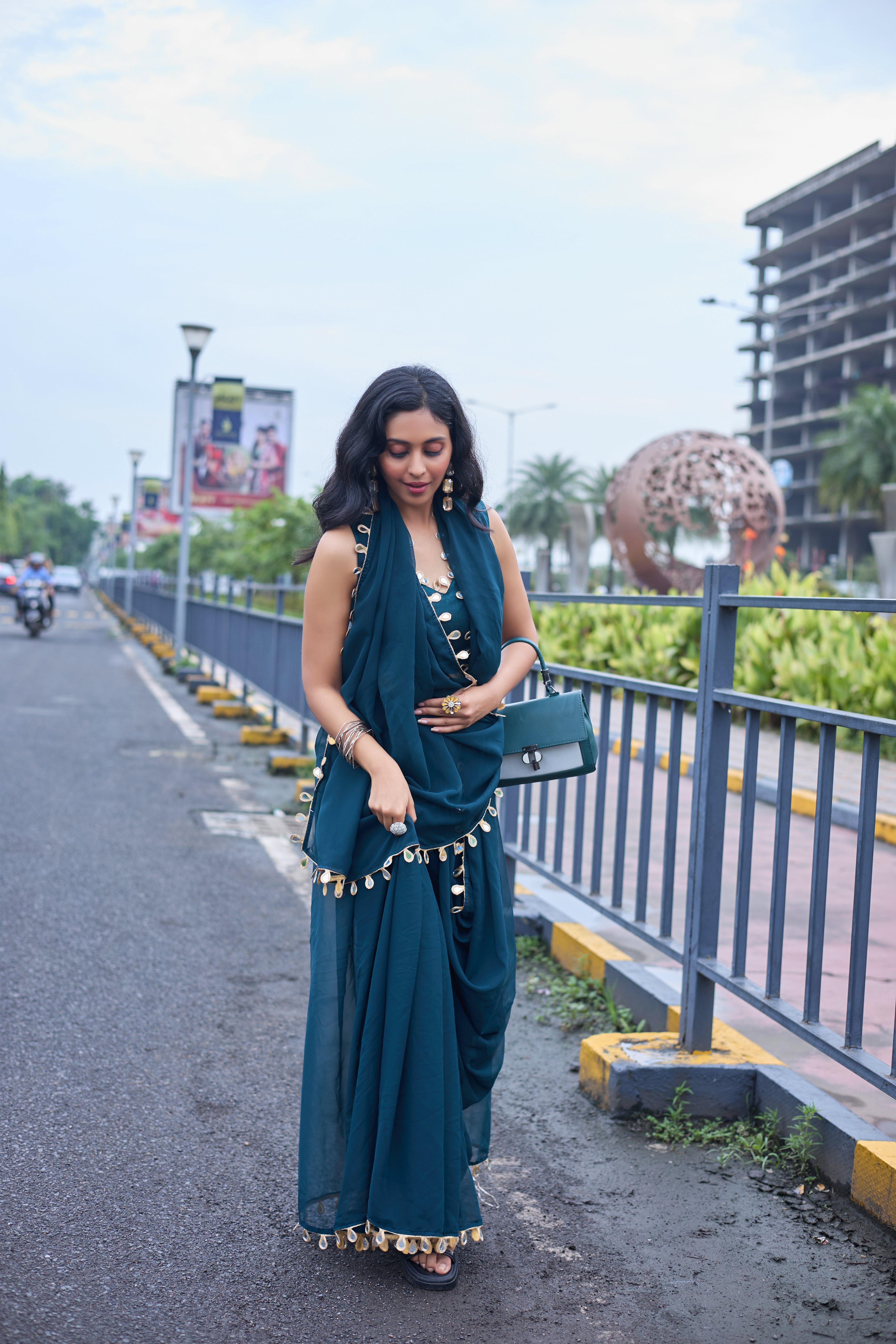 Designer Teal Georgette Saree with Gold Coin Border