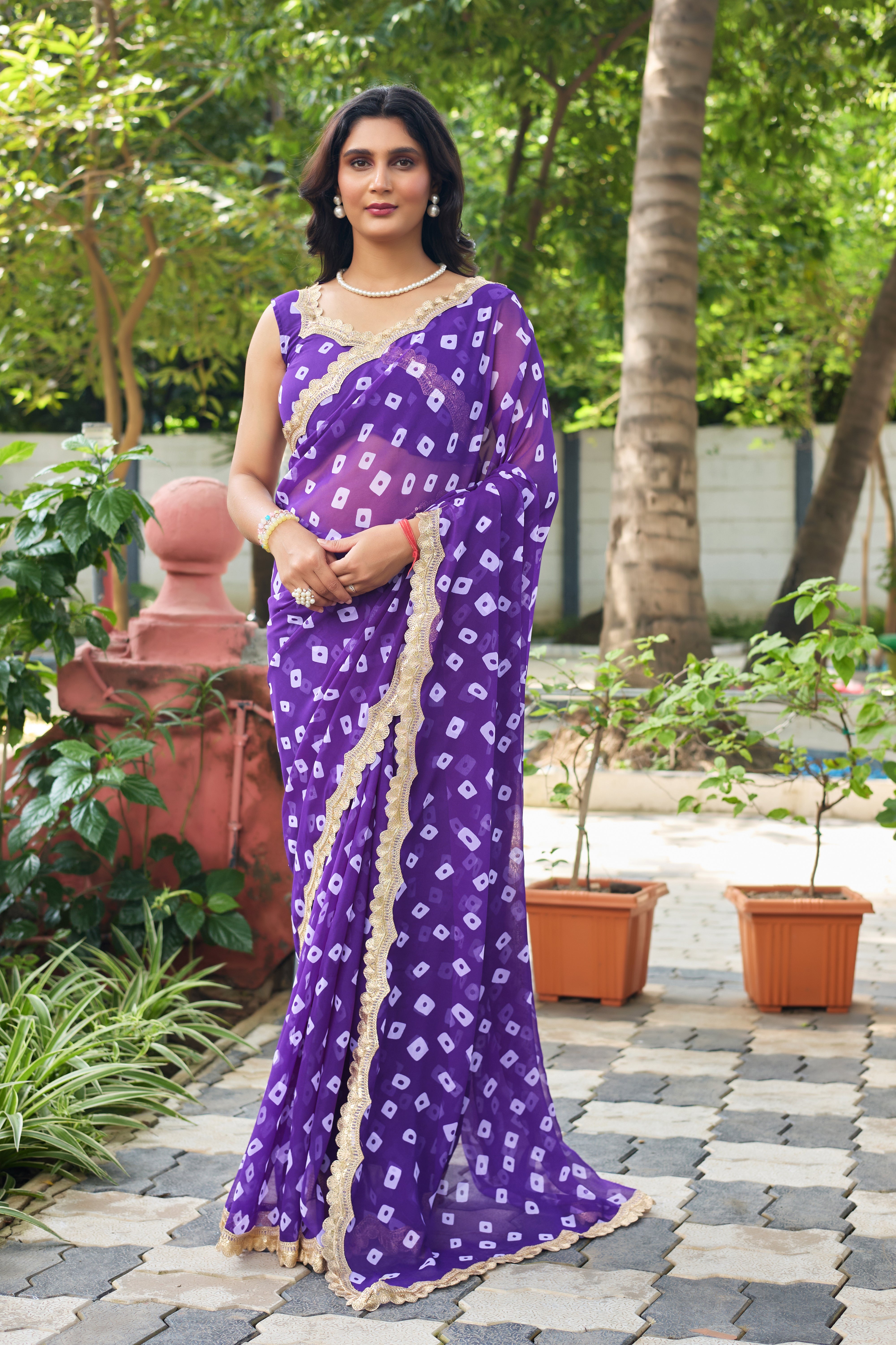 Fuchsia Bandhani Georgette Saree with Golden Lace Border
