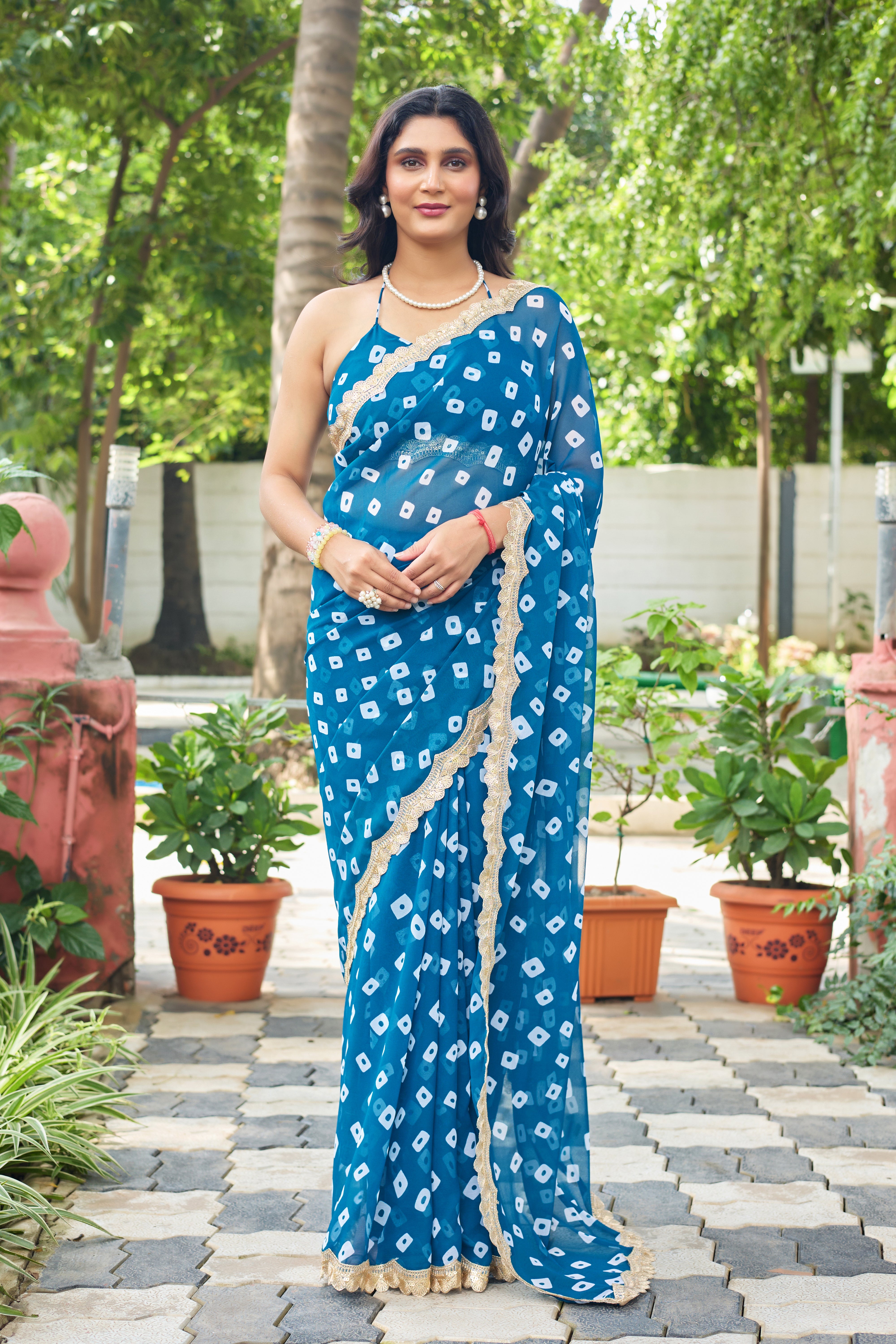Fuchsia Bandhani Georgette Saree with Golden Lace Border