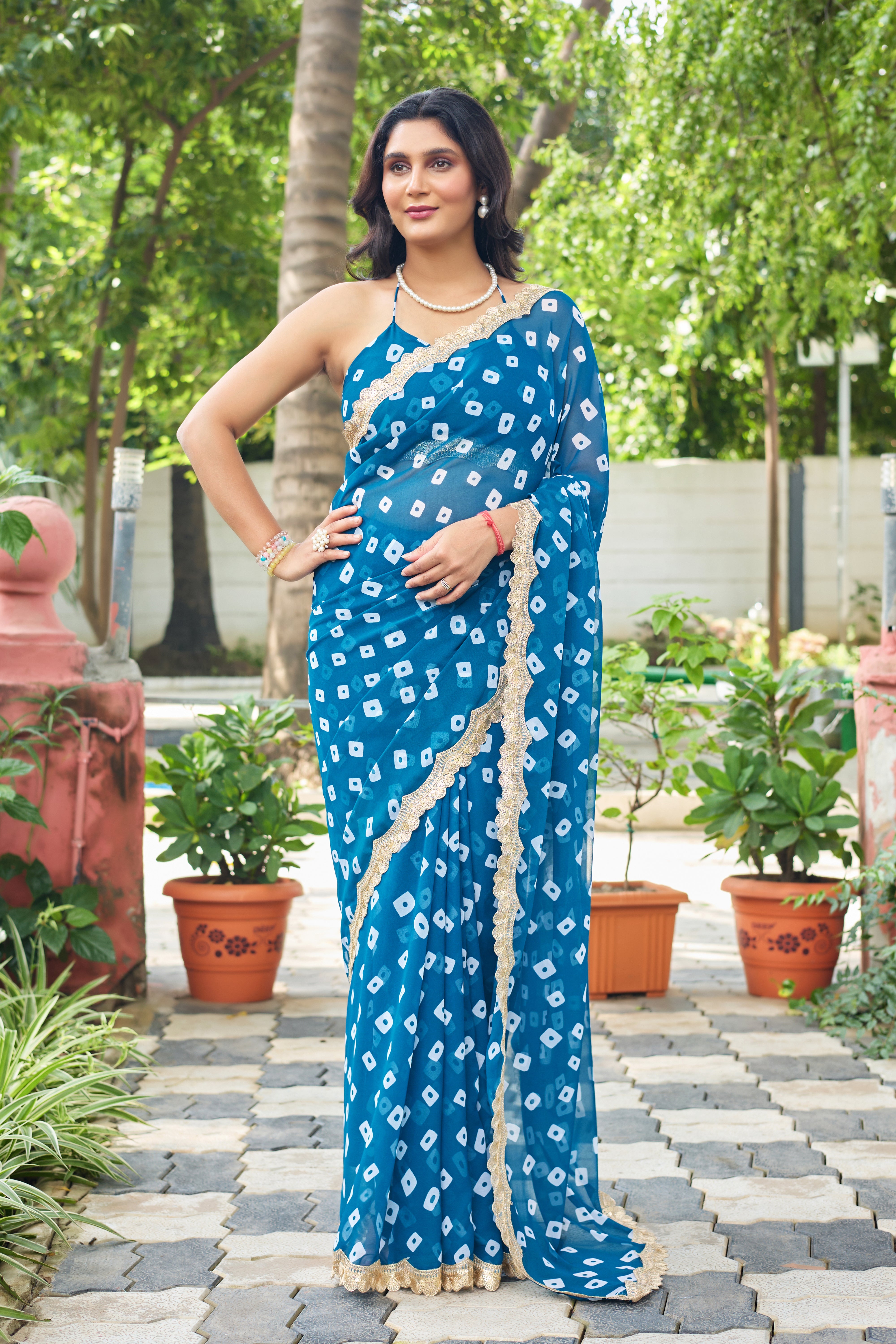Fuchsia Bandhani Georgette Saree with Golden Lace Border