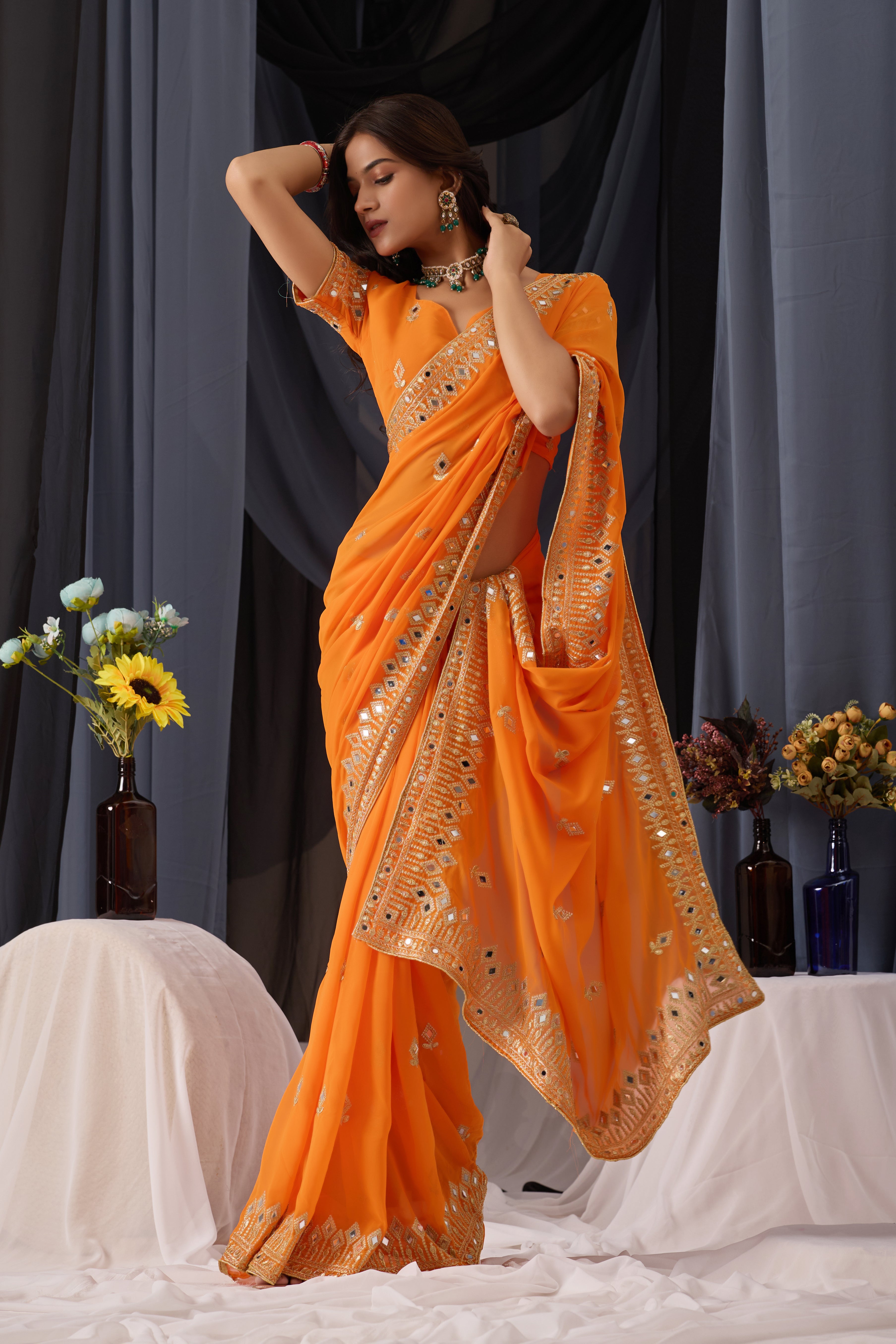 Elegant Orange Georgette Saree with Golden Embroidered Border
