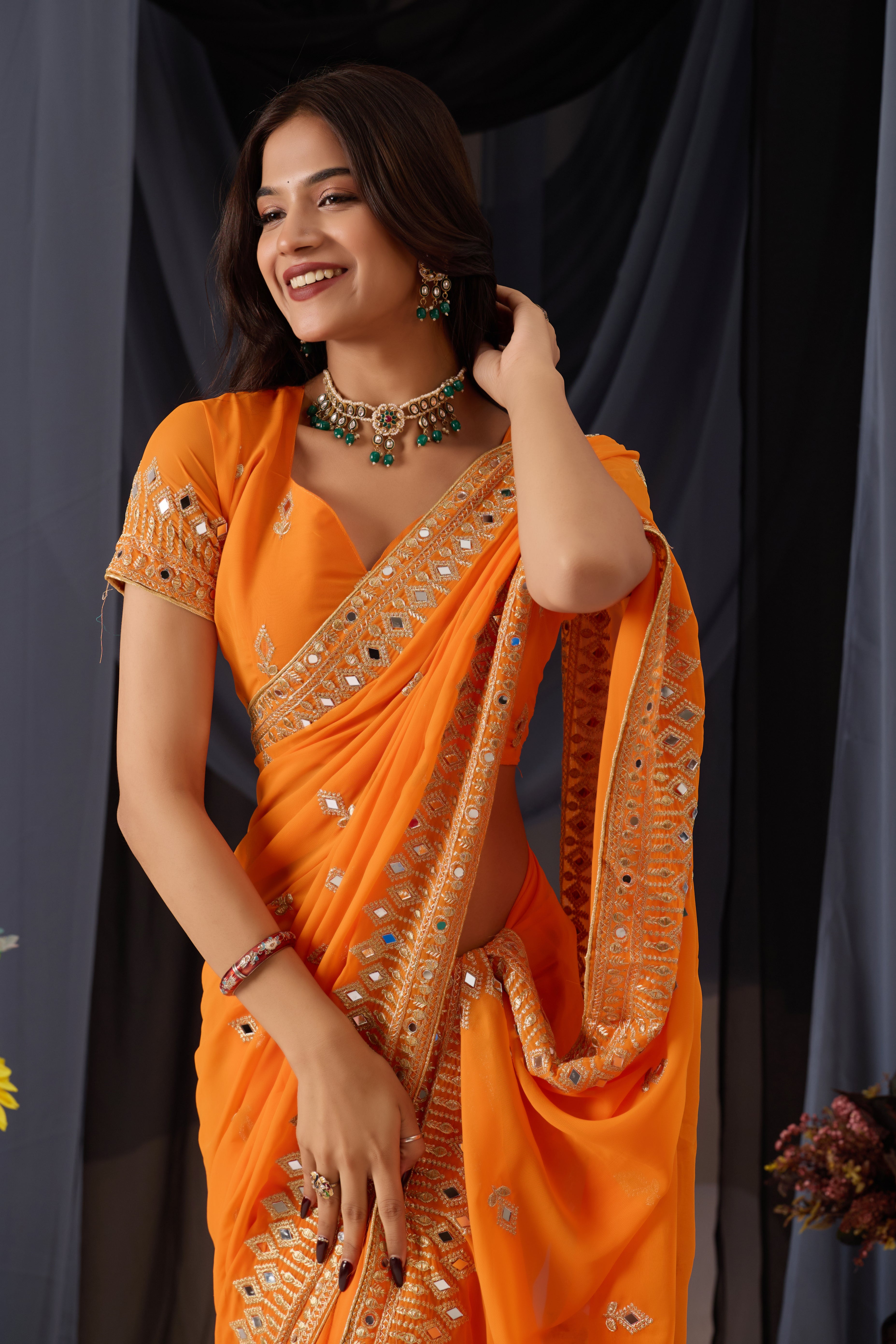 Elegant Orange Georgette Saree with Golden Embroidered Border