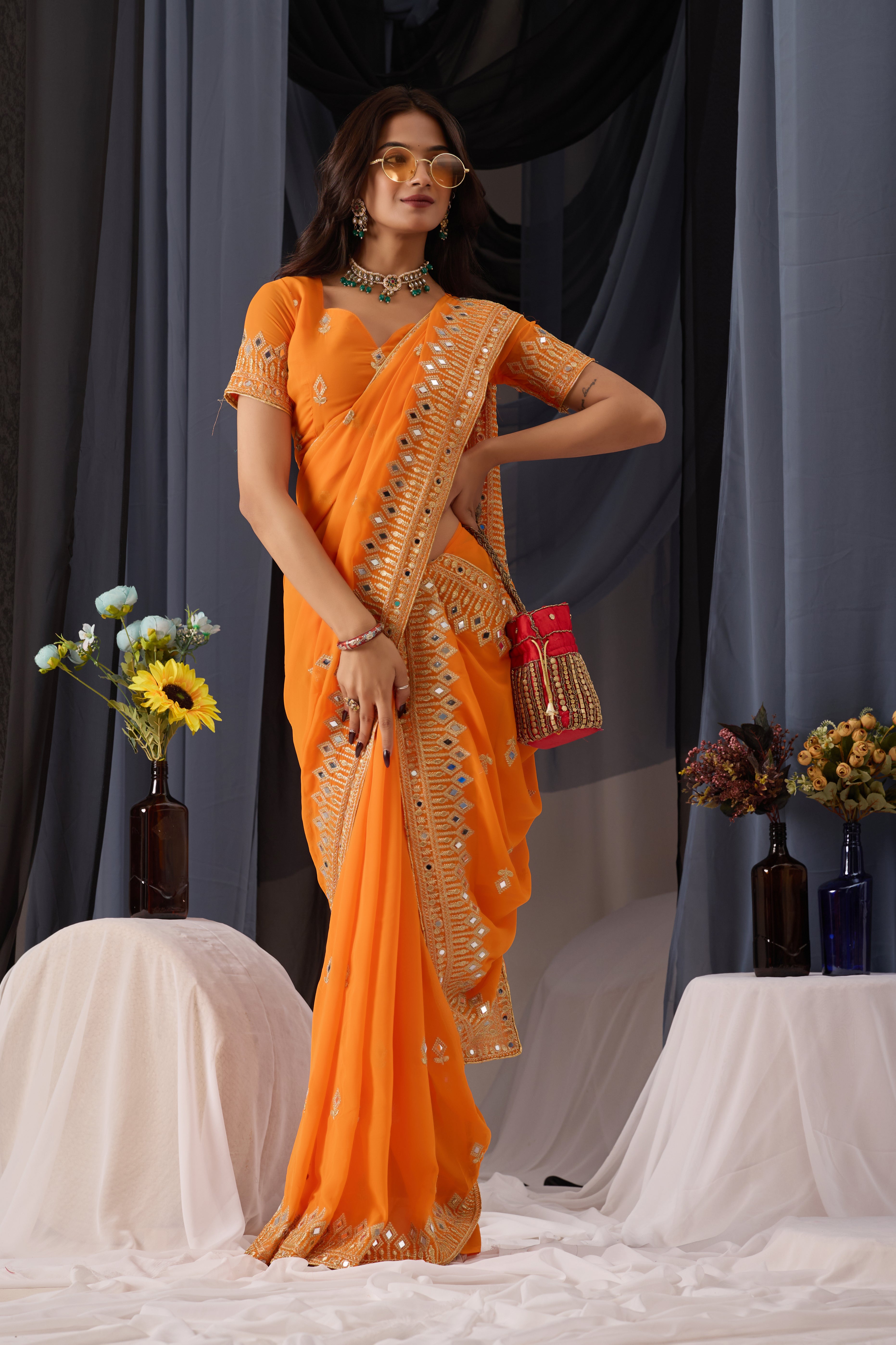 Elegant Orange Georgette Saree with Golden Embroidered Border