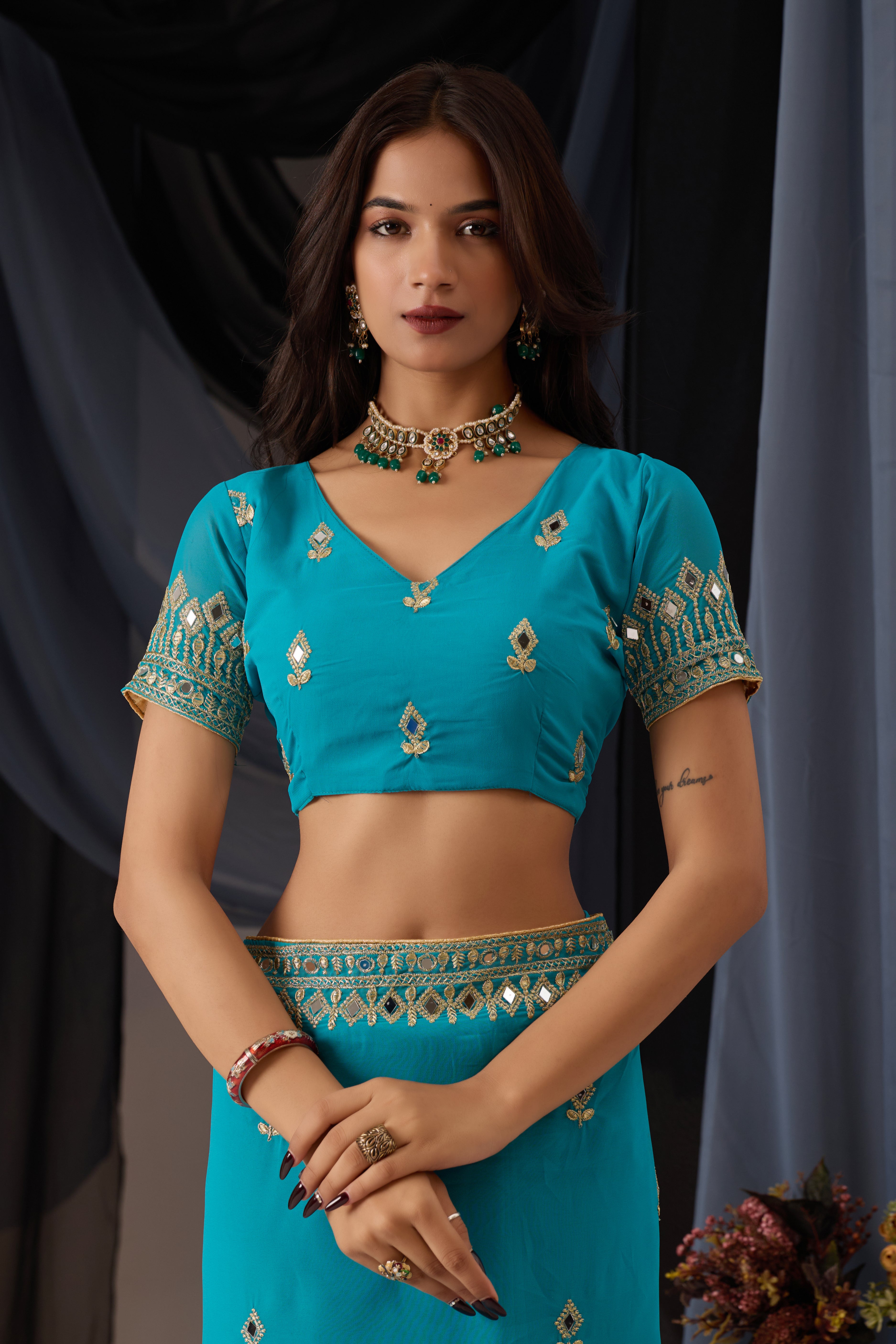 Elegant Sky Georgette Saree with Golden Embroidered Border