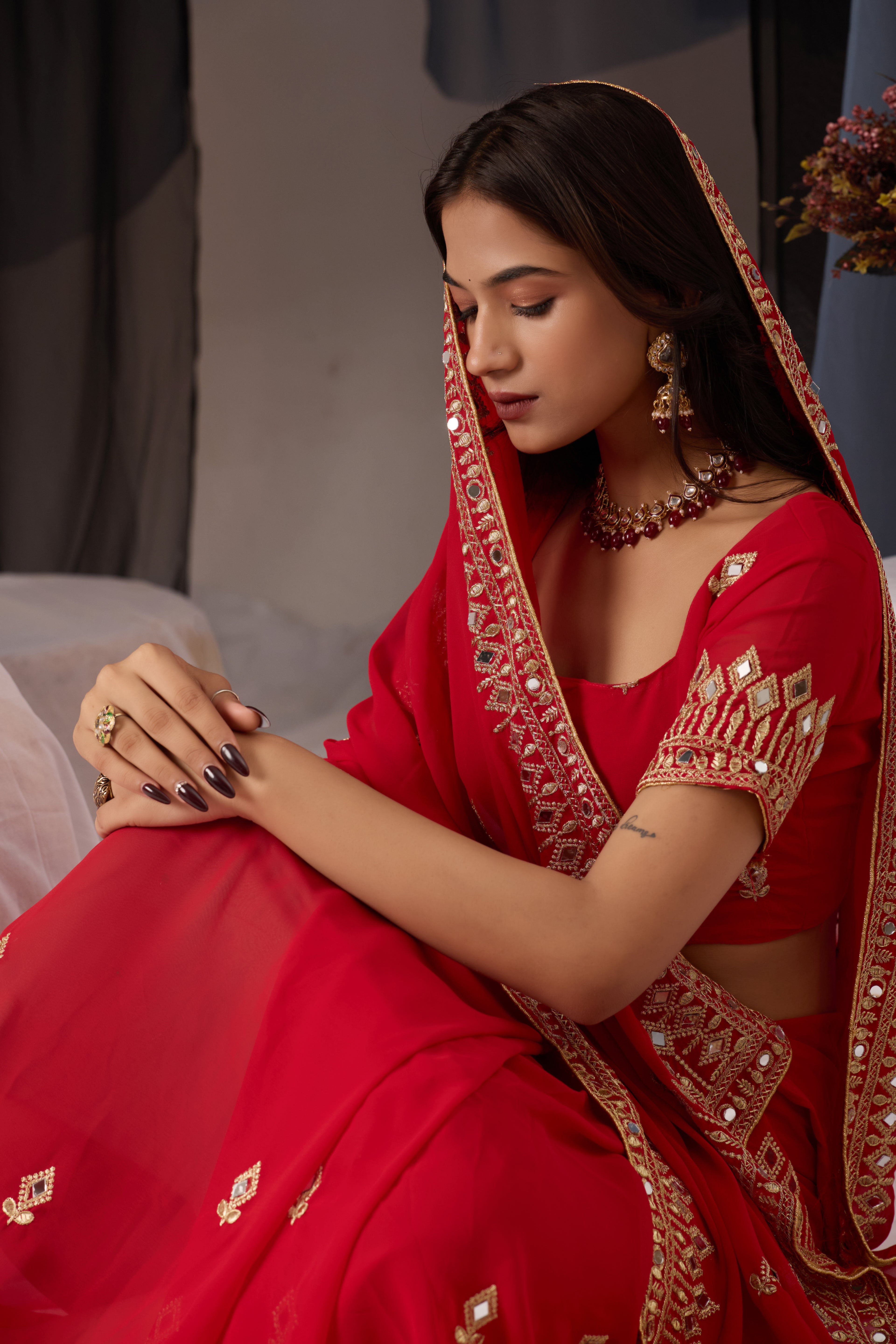 Elegant Red Georgette Saree with Golden Embroidered Border