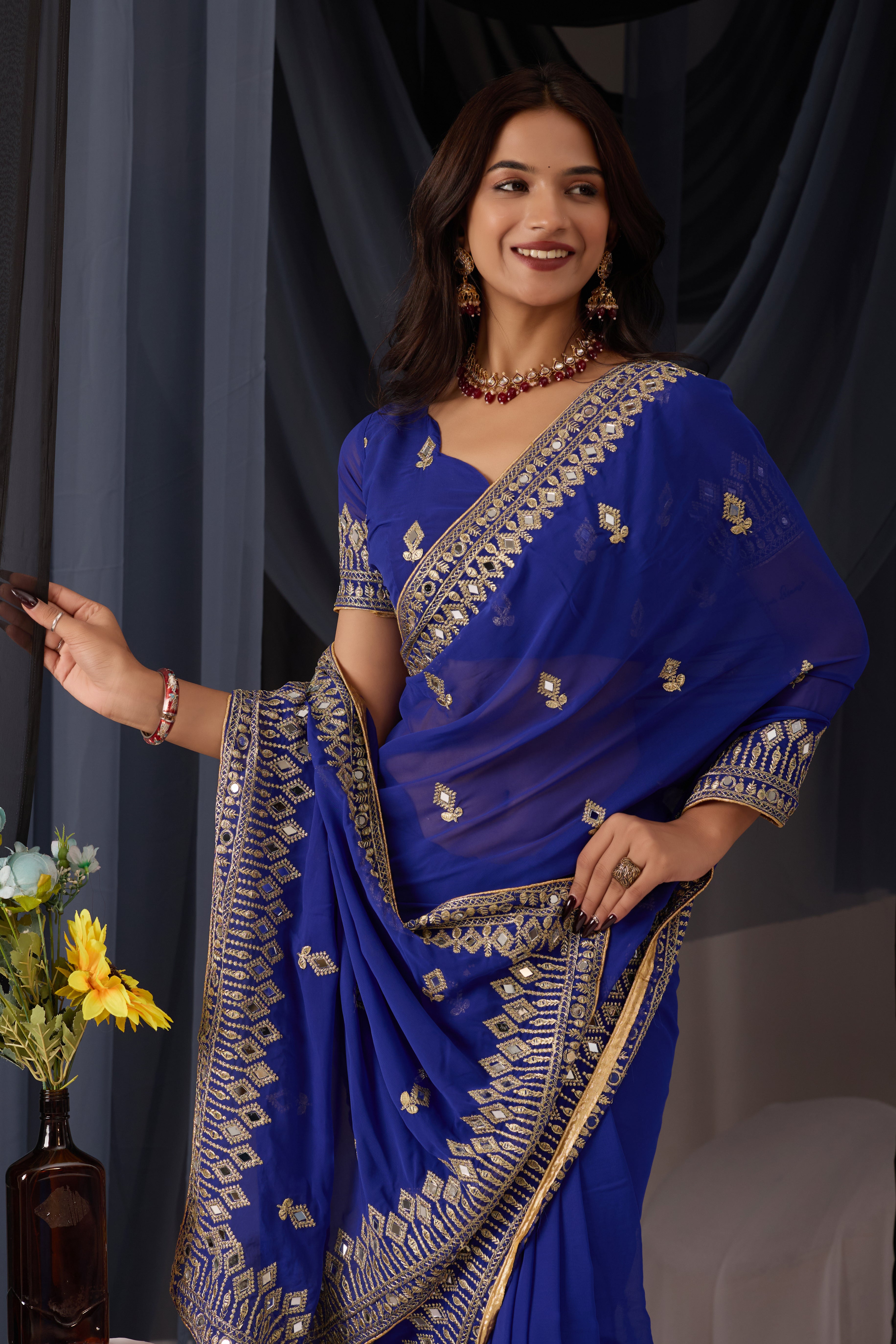 Elegant Blue Georgette Saree with Golden Embroidered Border