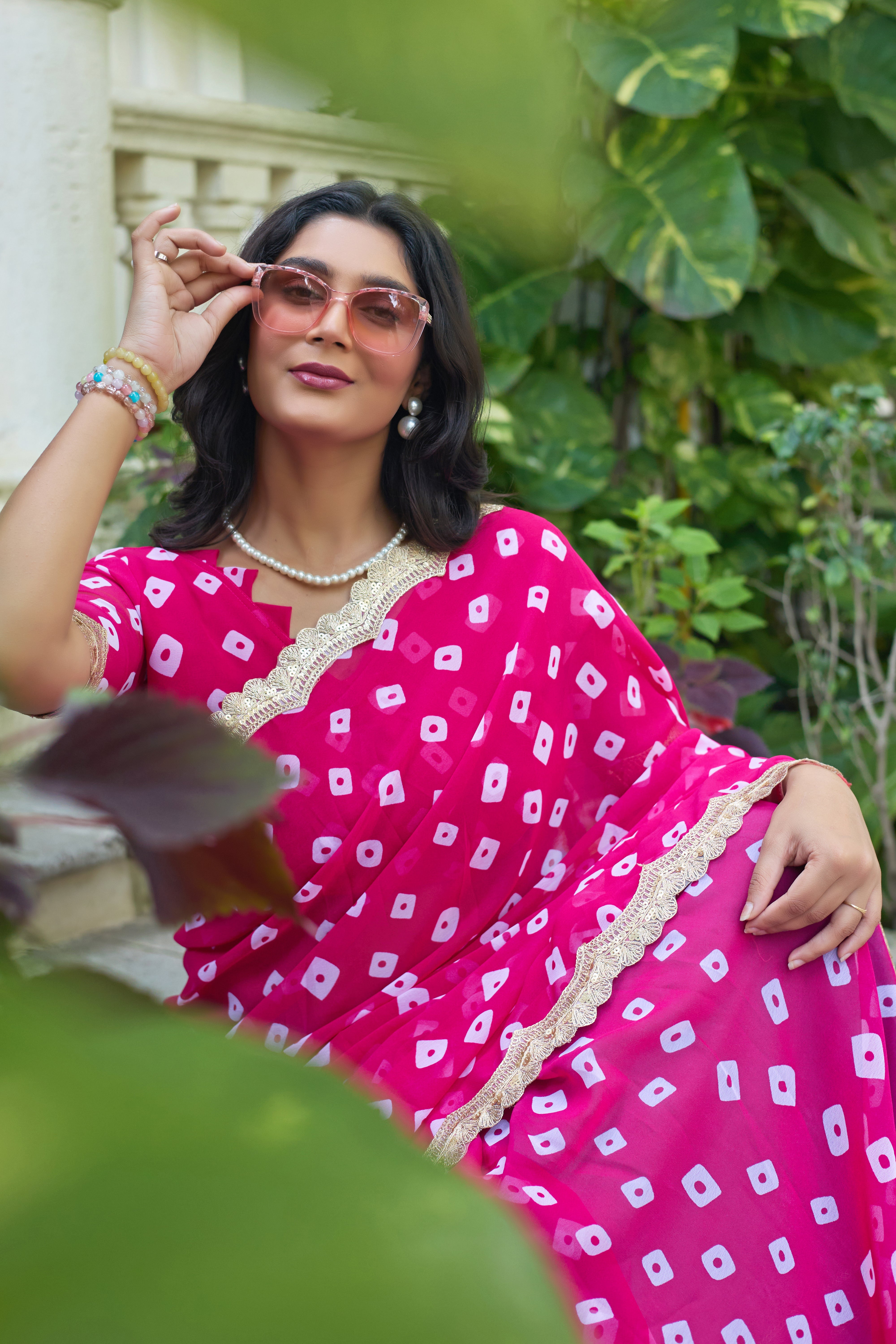 Fuchsia Bandhani Georgette Saree with Golden Lace Border