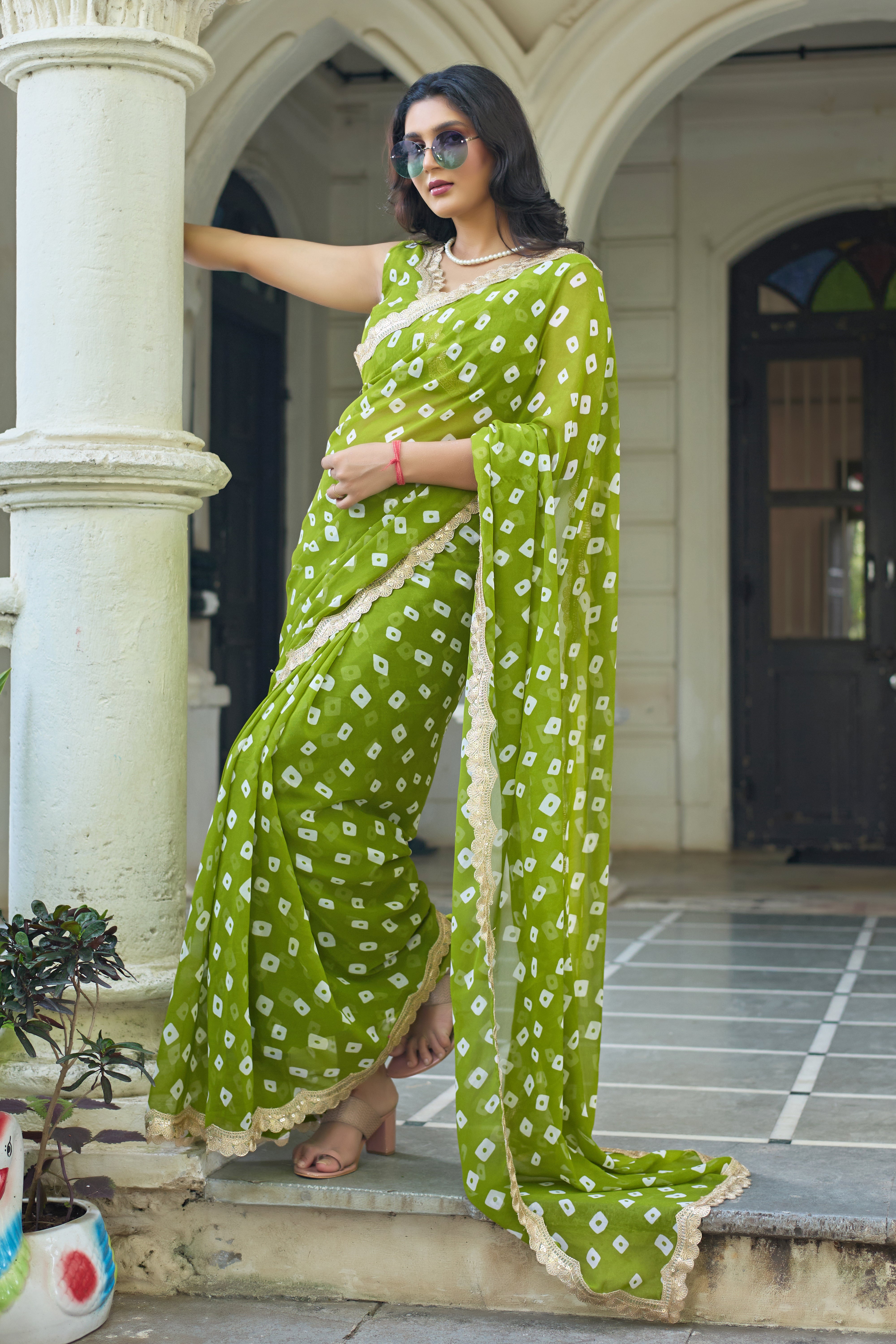 Fuchsia Bandhani Georgette Saree with Golden Lace Border