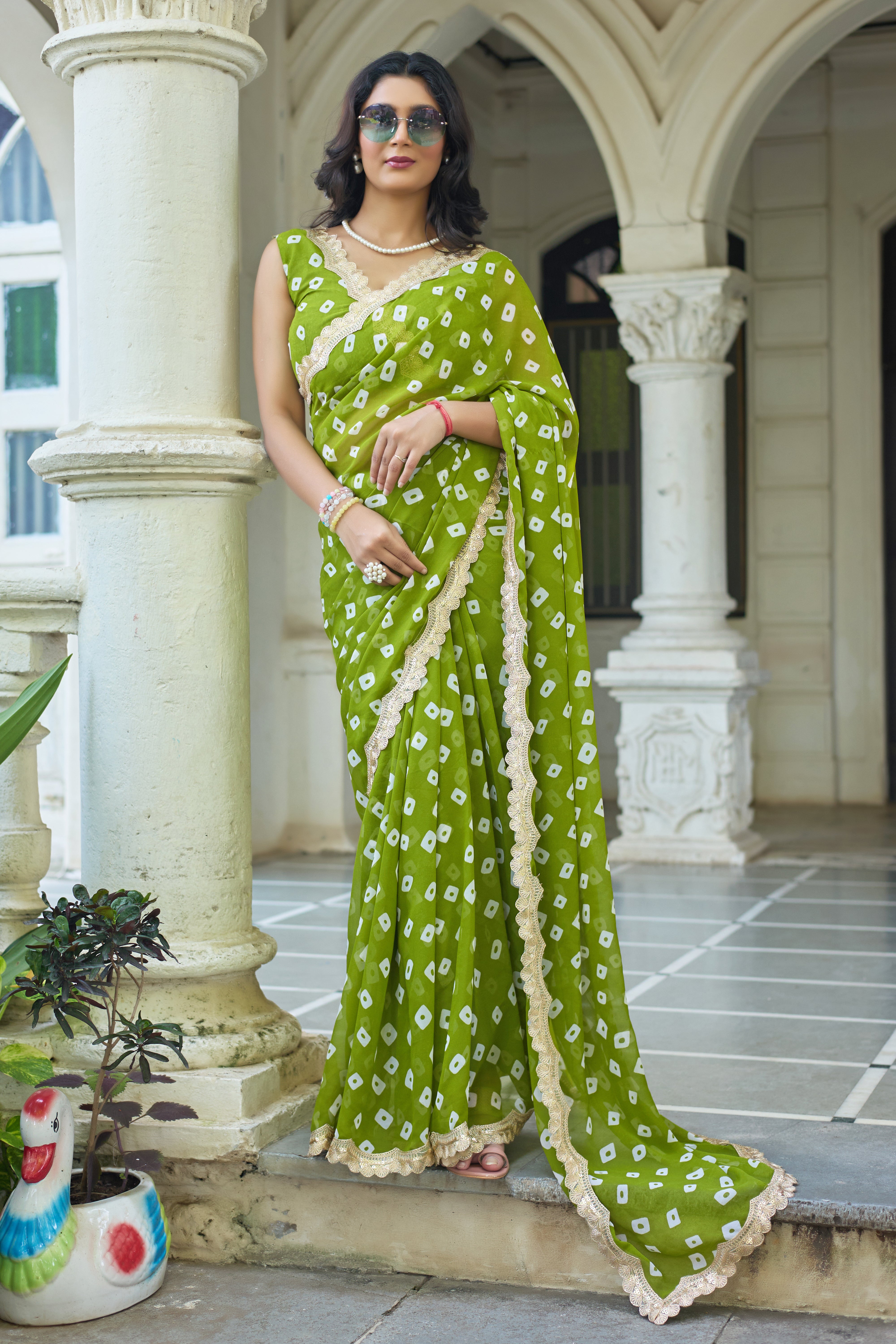 Fuchsia Bandhani Georgette Saree with Golden Lace Border