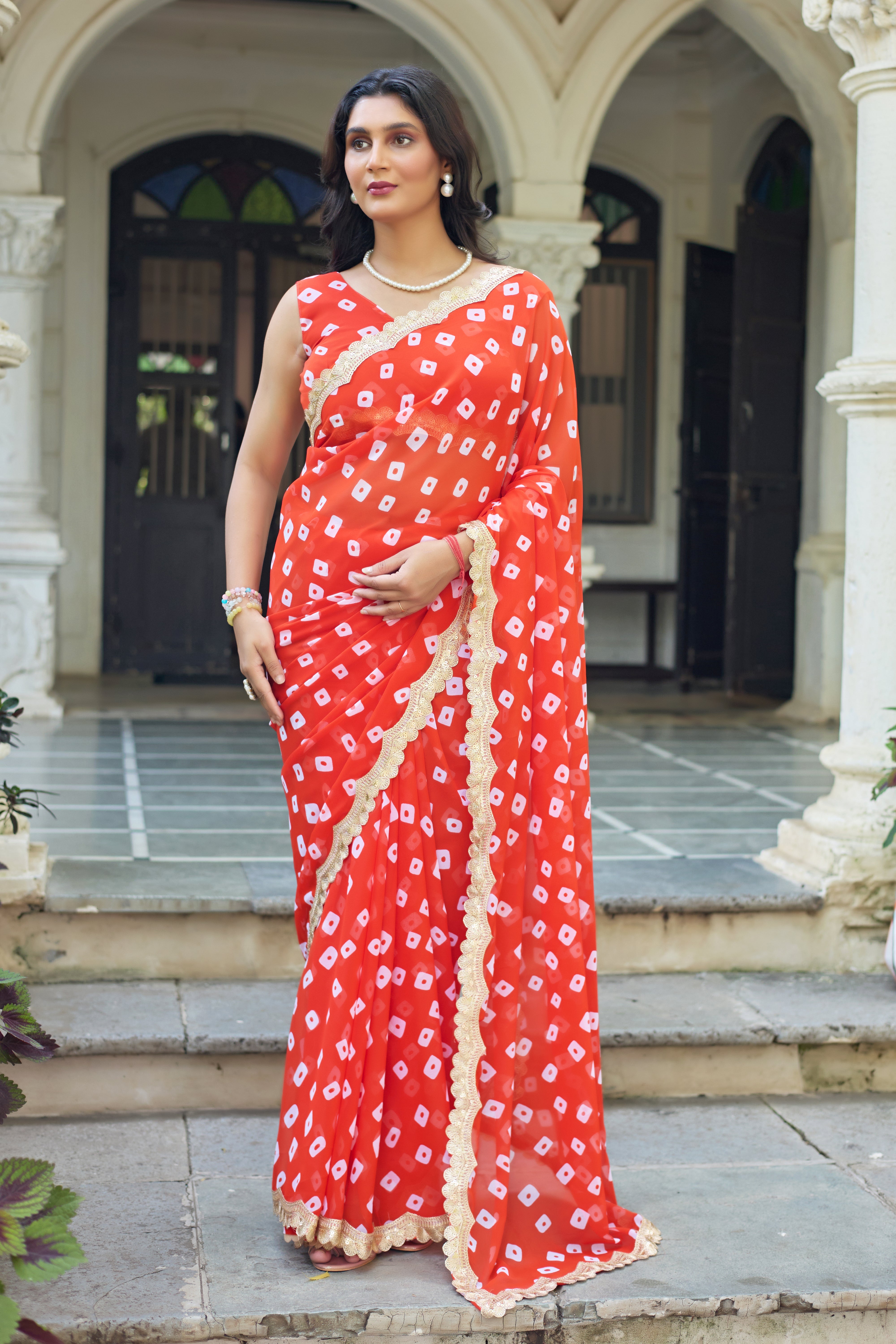 Fuchsia Bandhani Georgette Saree with Golden Lace Border