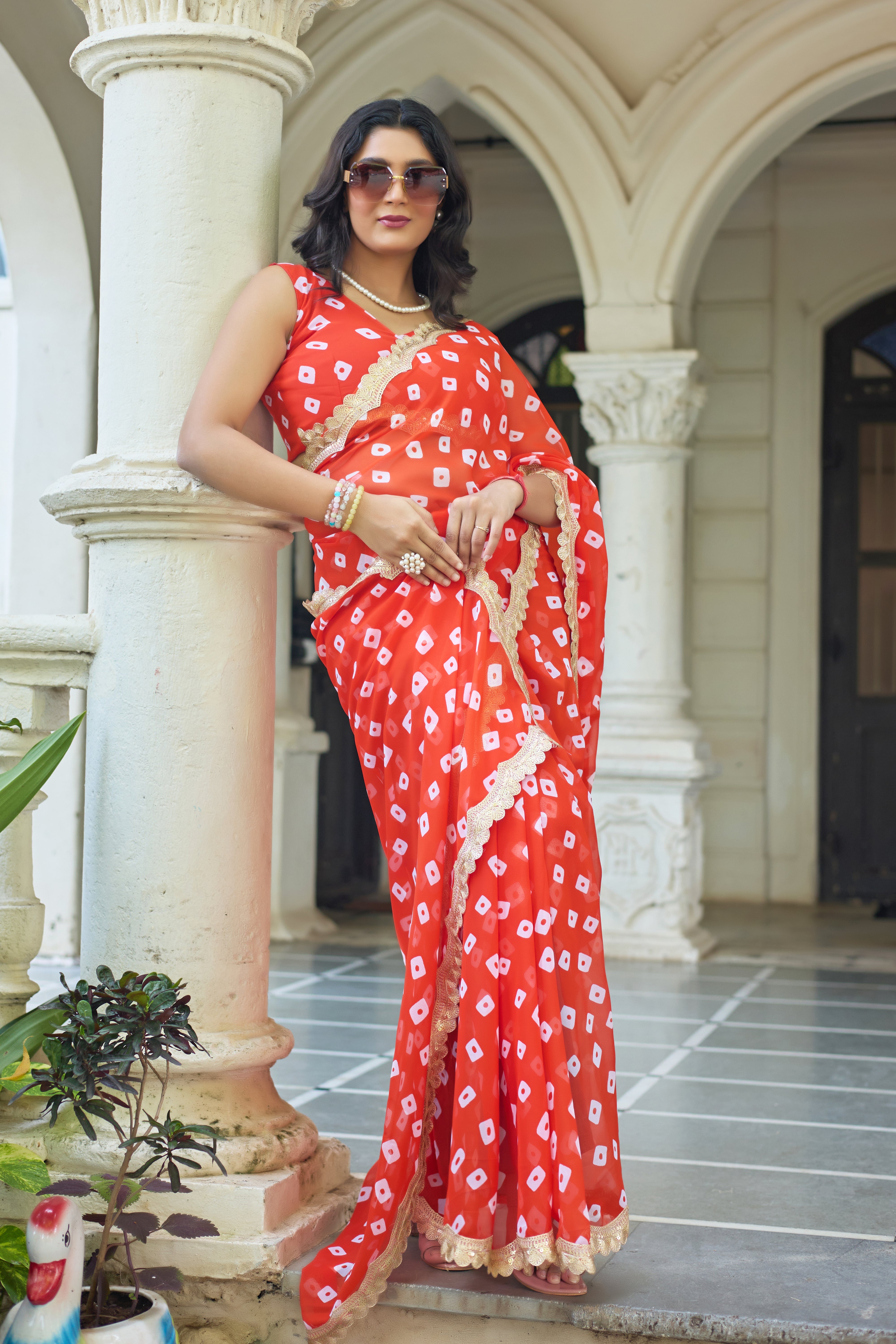 Fuchsia Bandhani Georgette Saree with Golden Lace Border
