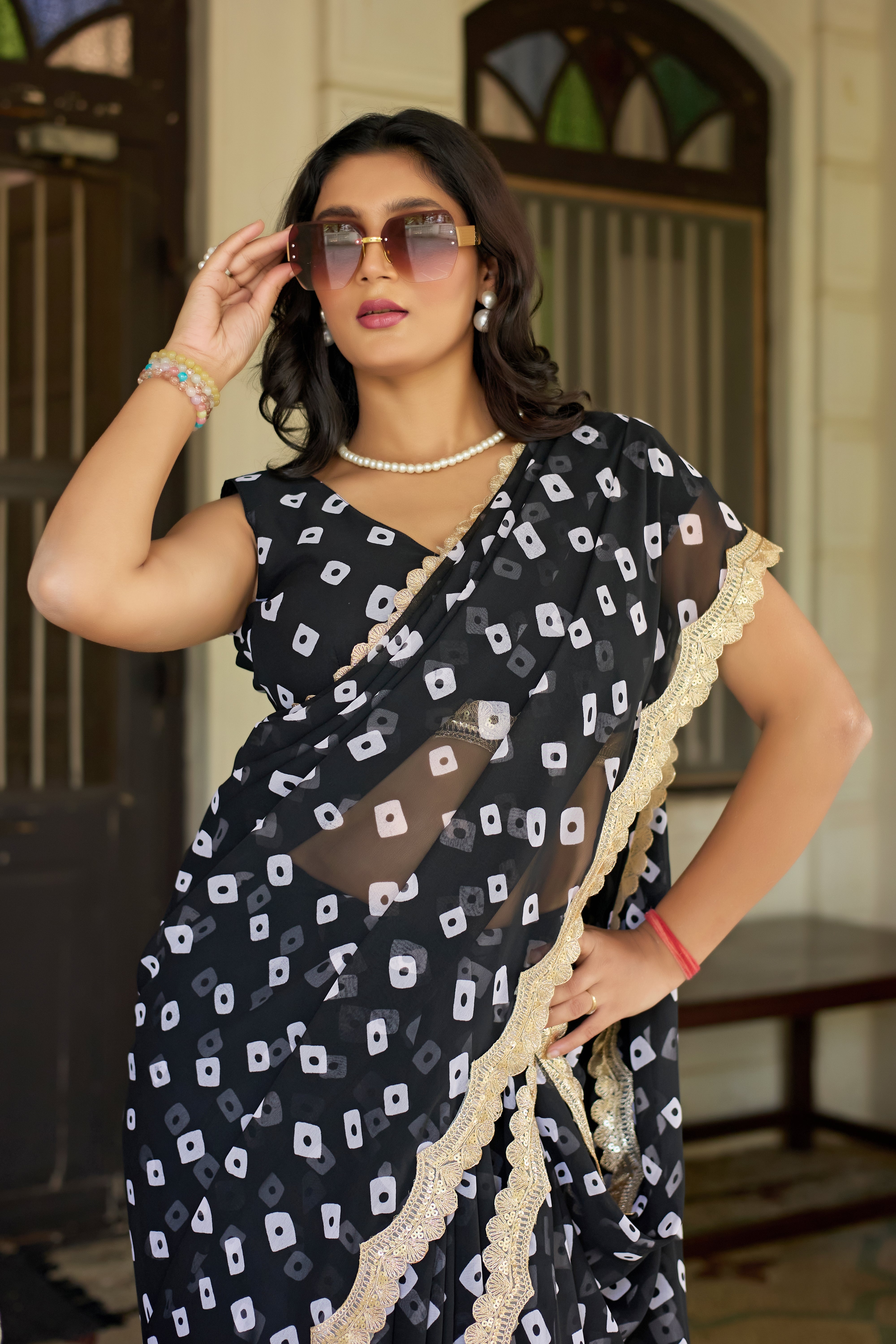 Fuchsia Bandhani Georgette Saree with Golden Lace Border