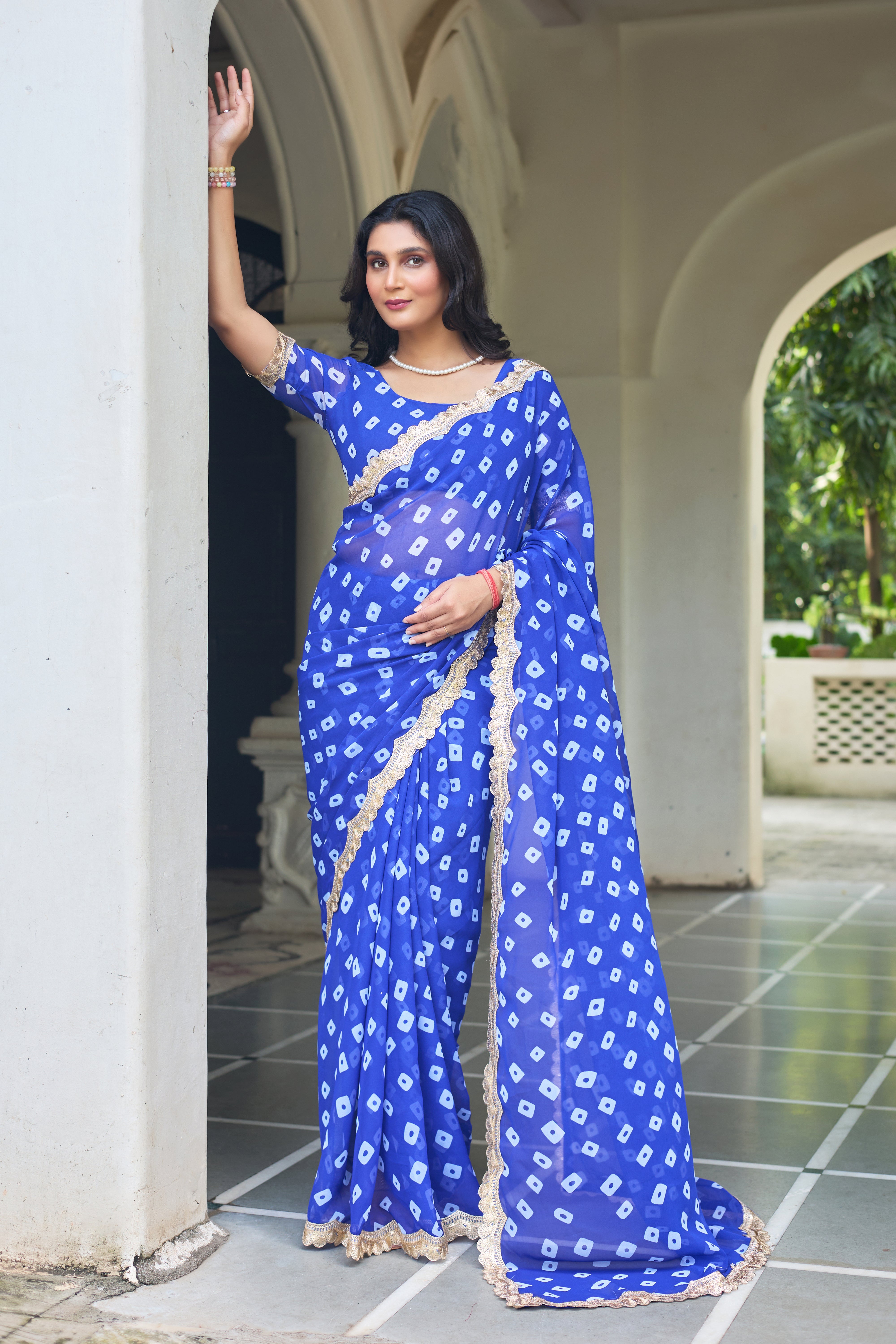 Fuchsia Bandhani Georgette Saree with Golden Lace Border