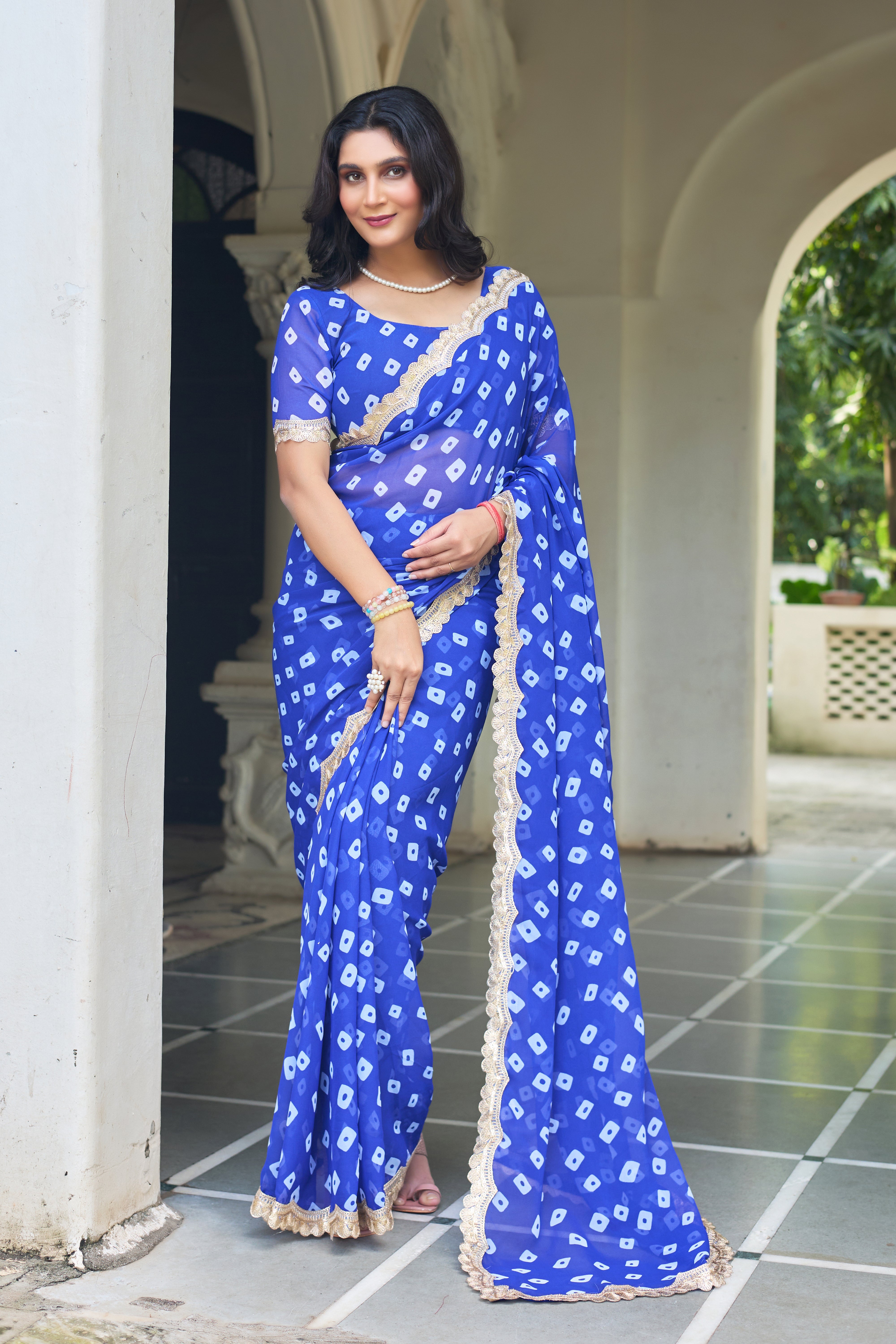 Fuchsia Bandhani Georgette Saree with Golden Lace Border