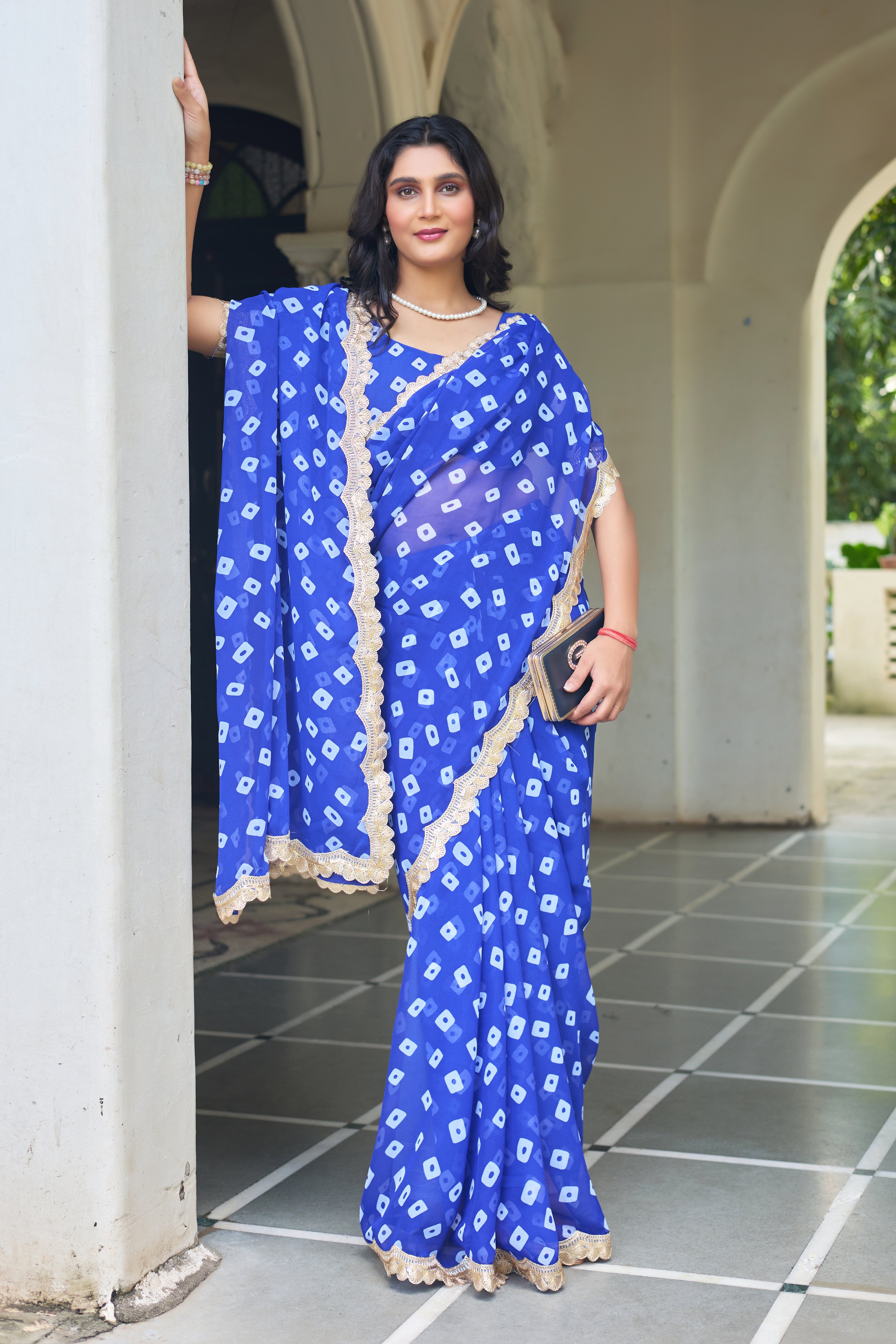 Fuchsia Bandhani Georgette Saree with Golden Lace Border
