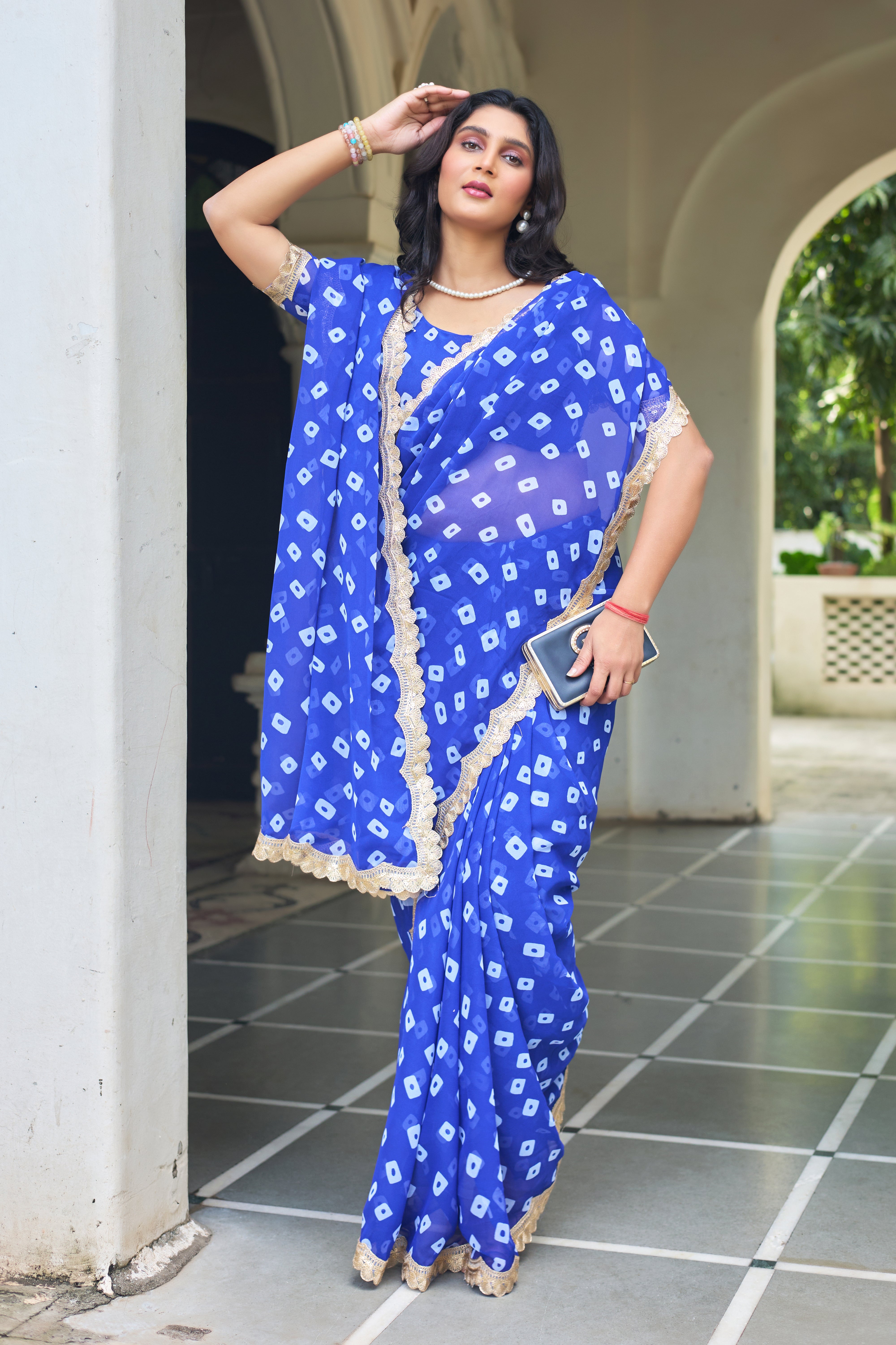 Fuchsia Bandhani Georgette Saree with Golden Lace Border