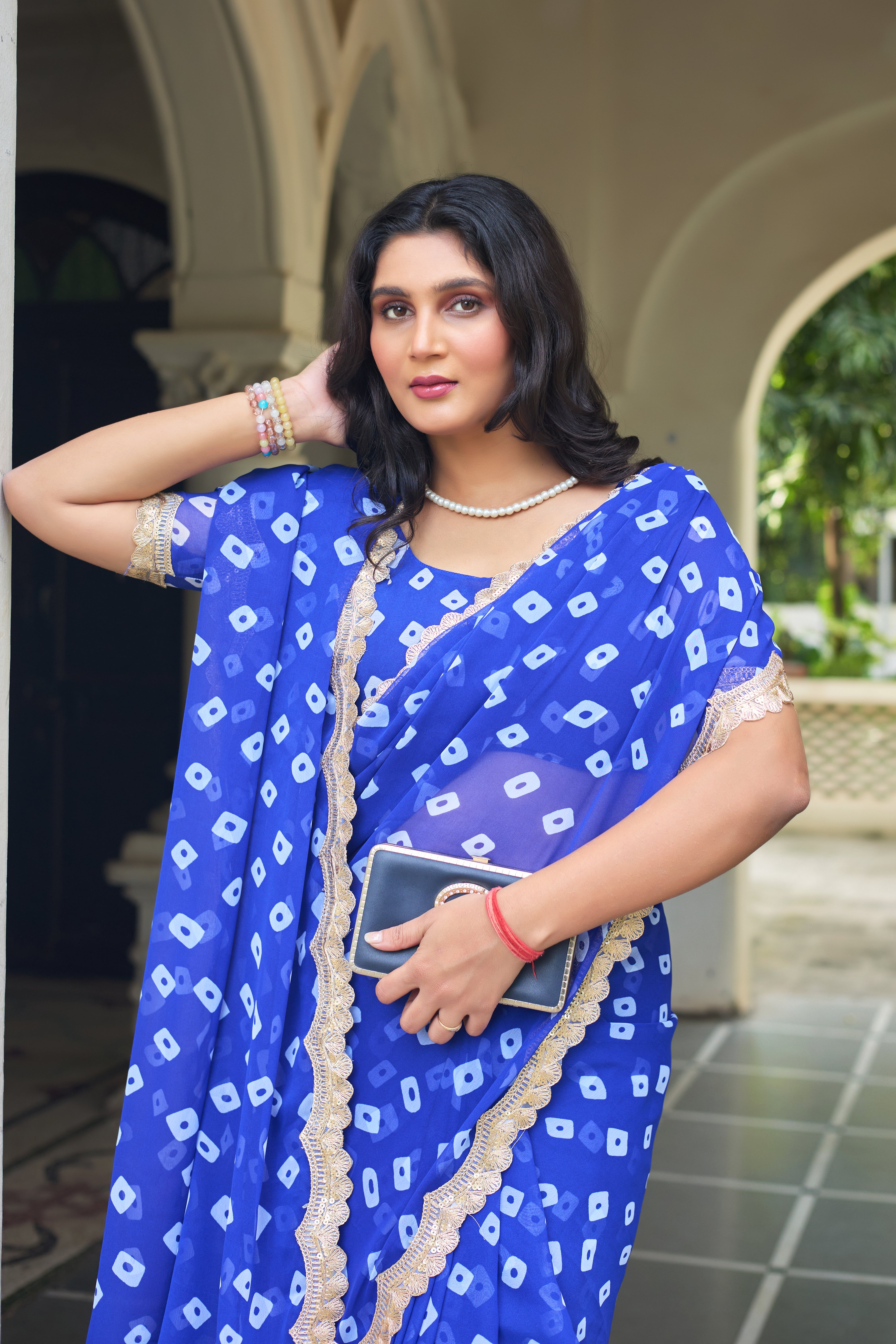 Fuchsia Bandhani Georgette Saree with Golden Lace Border