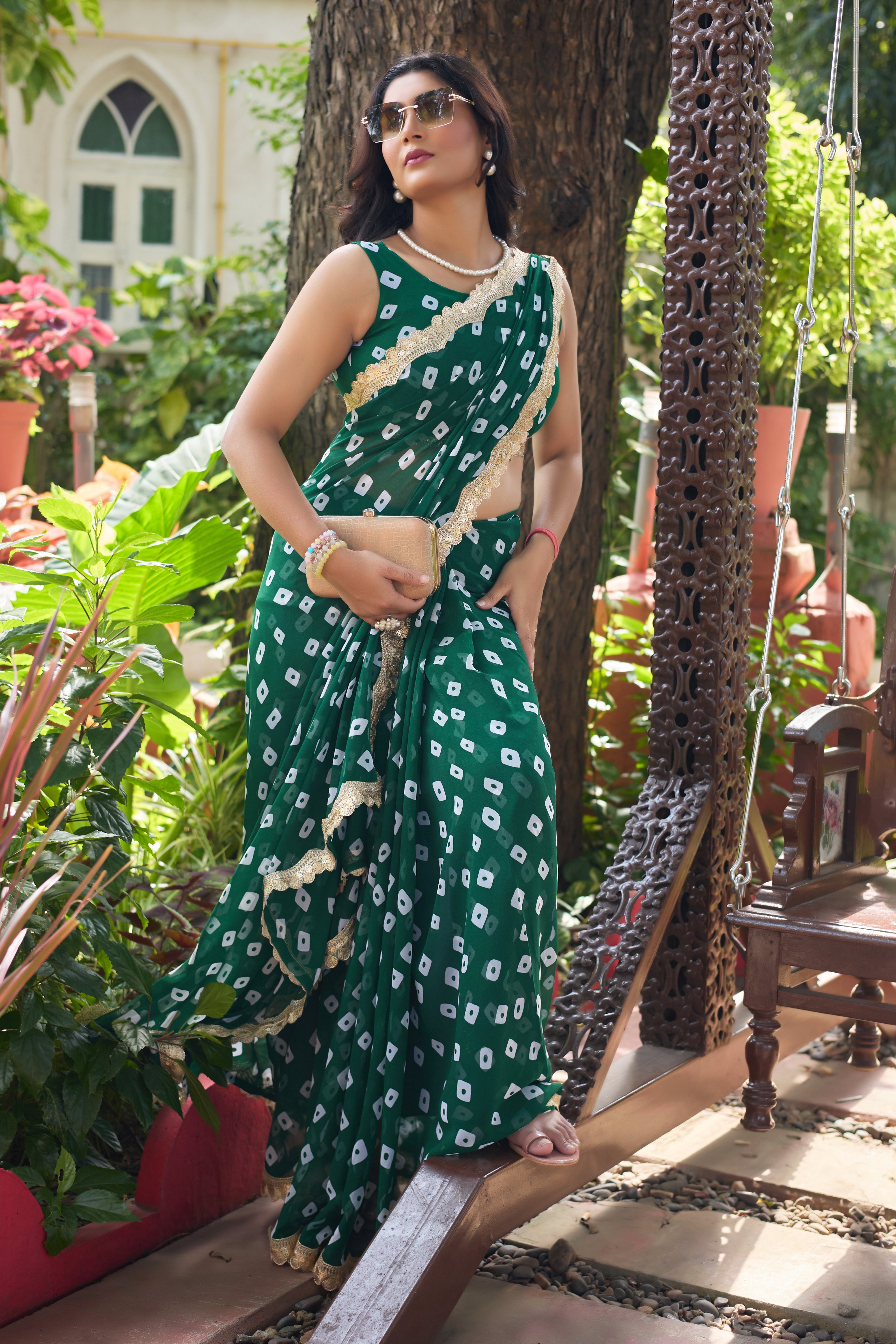 Fuchsia Bandhani Georgette Saree with Golden Lace Border
