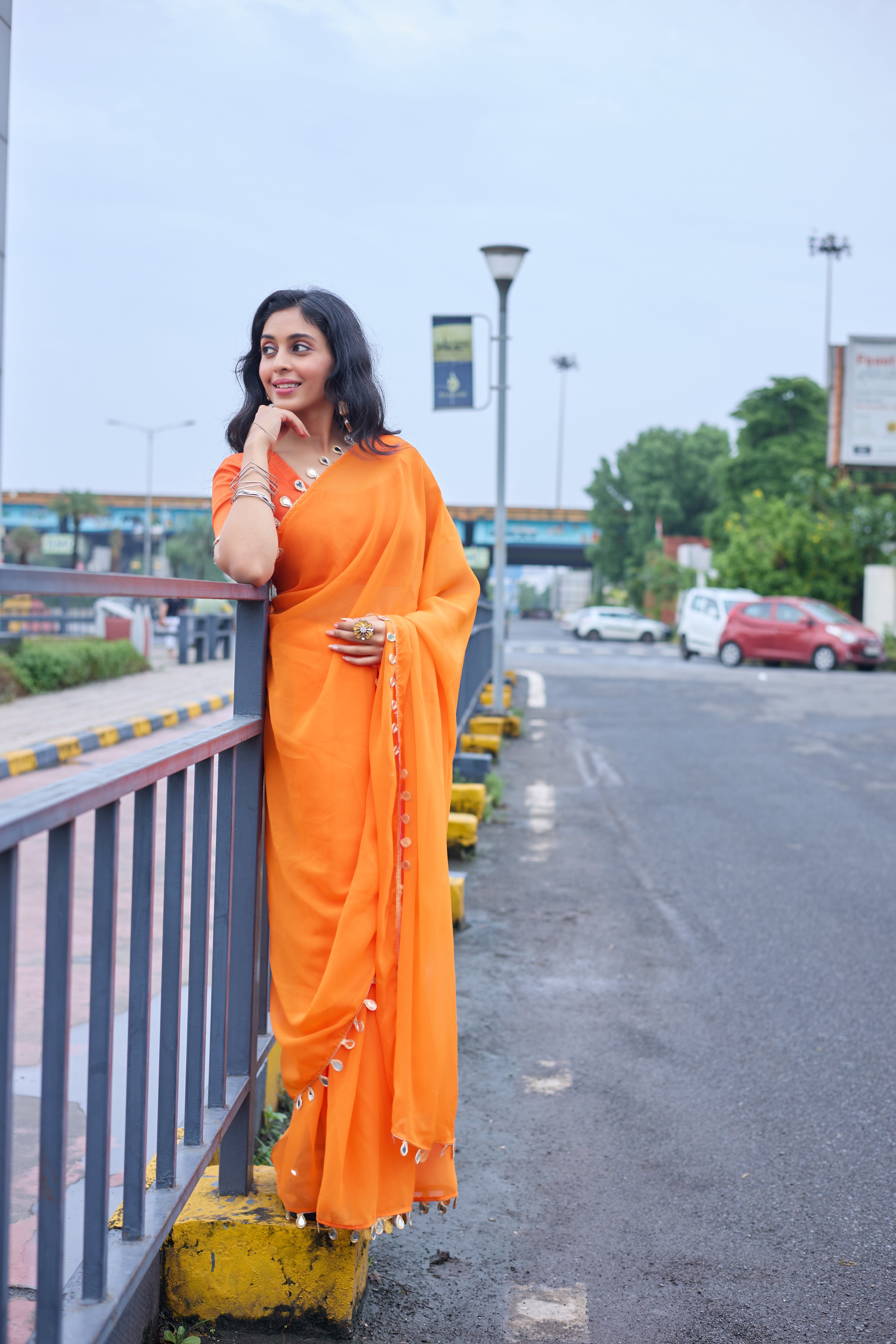 Sunset Glow Orange Saree with Shell Embellishments
