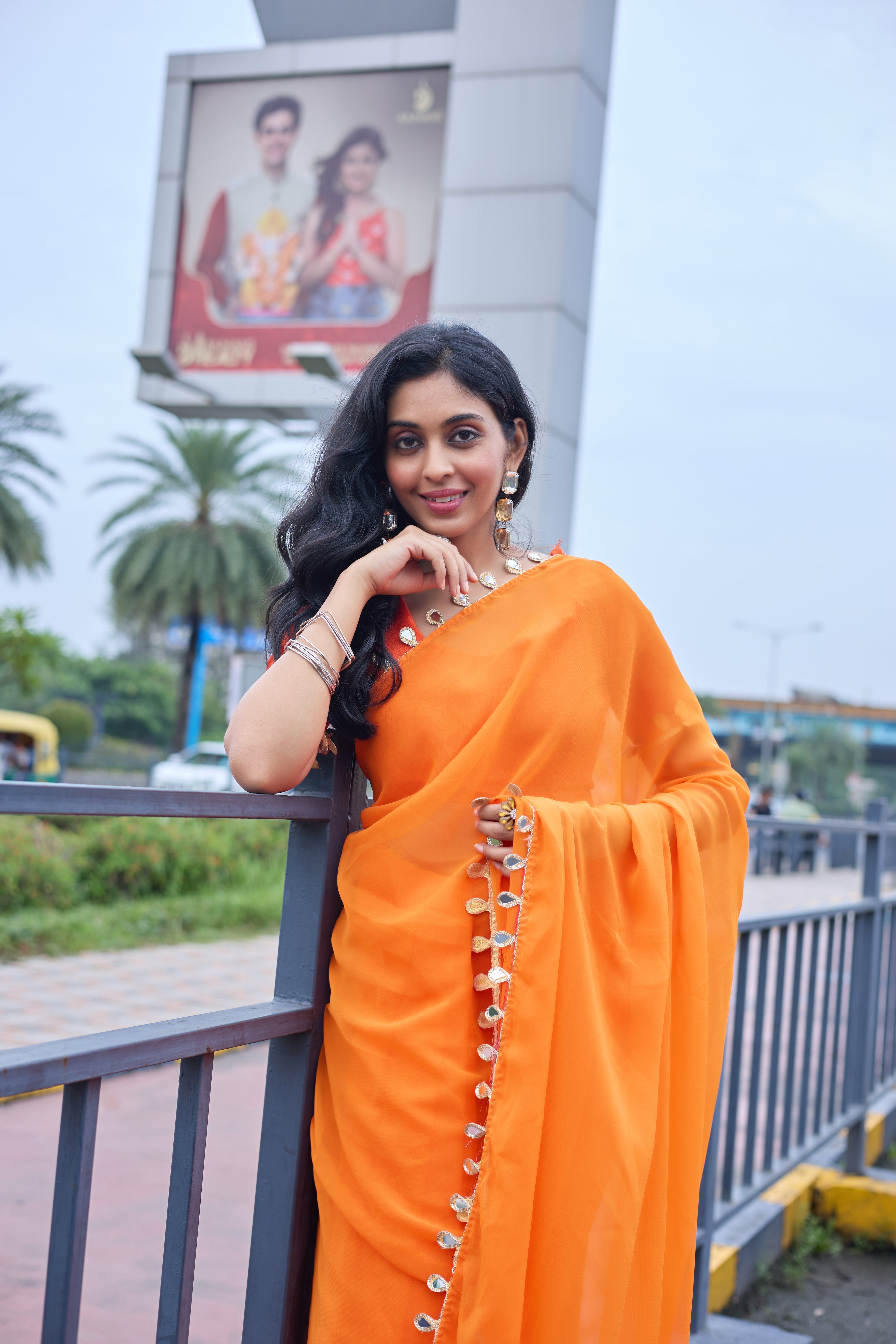 Sunset Glow Orange Saree with Shell Embellishments