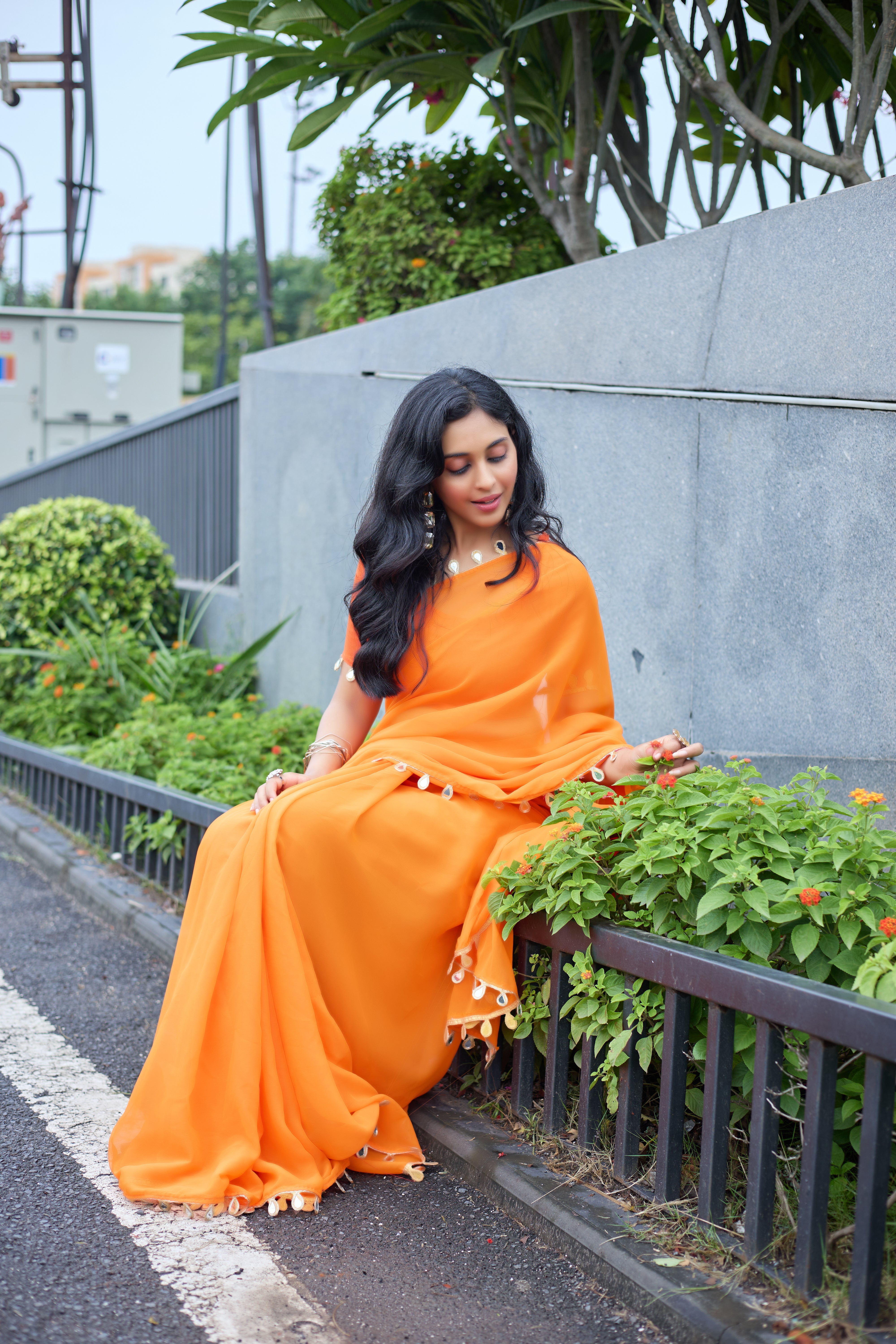 Sunset Glow Orange Saree with Shell Embellishments