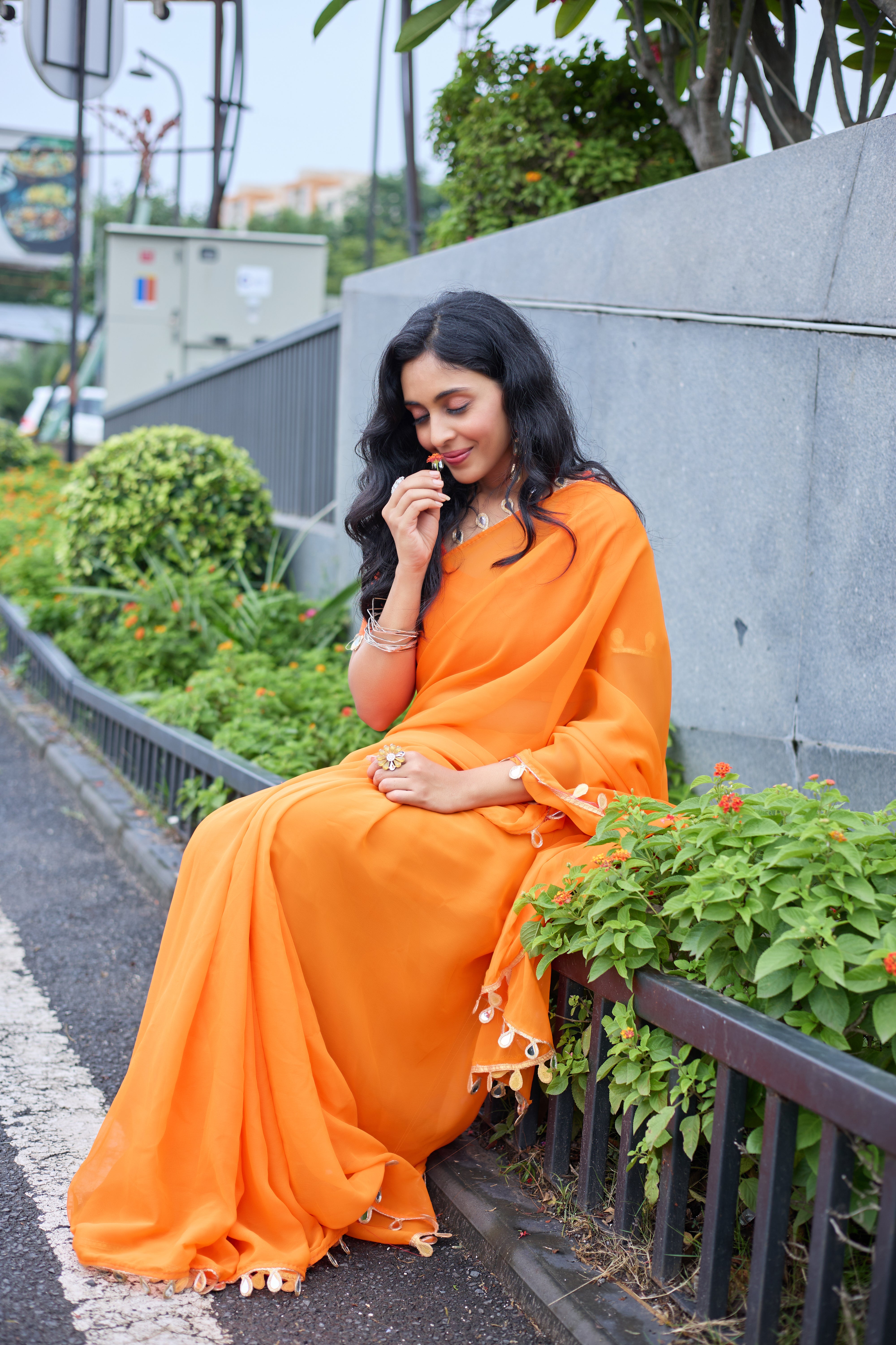 Sunset Glow Orange Saree with Shell Embellishments