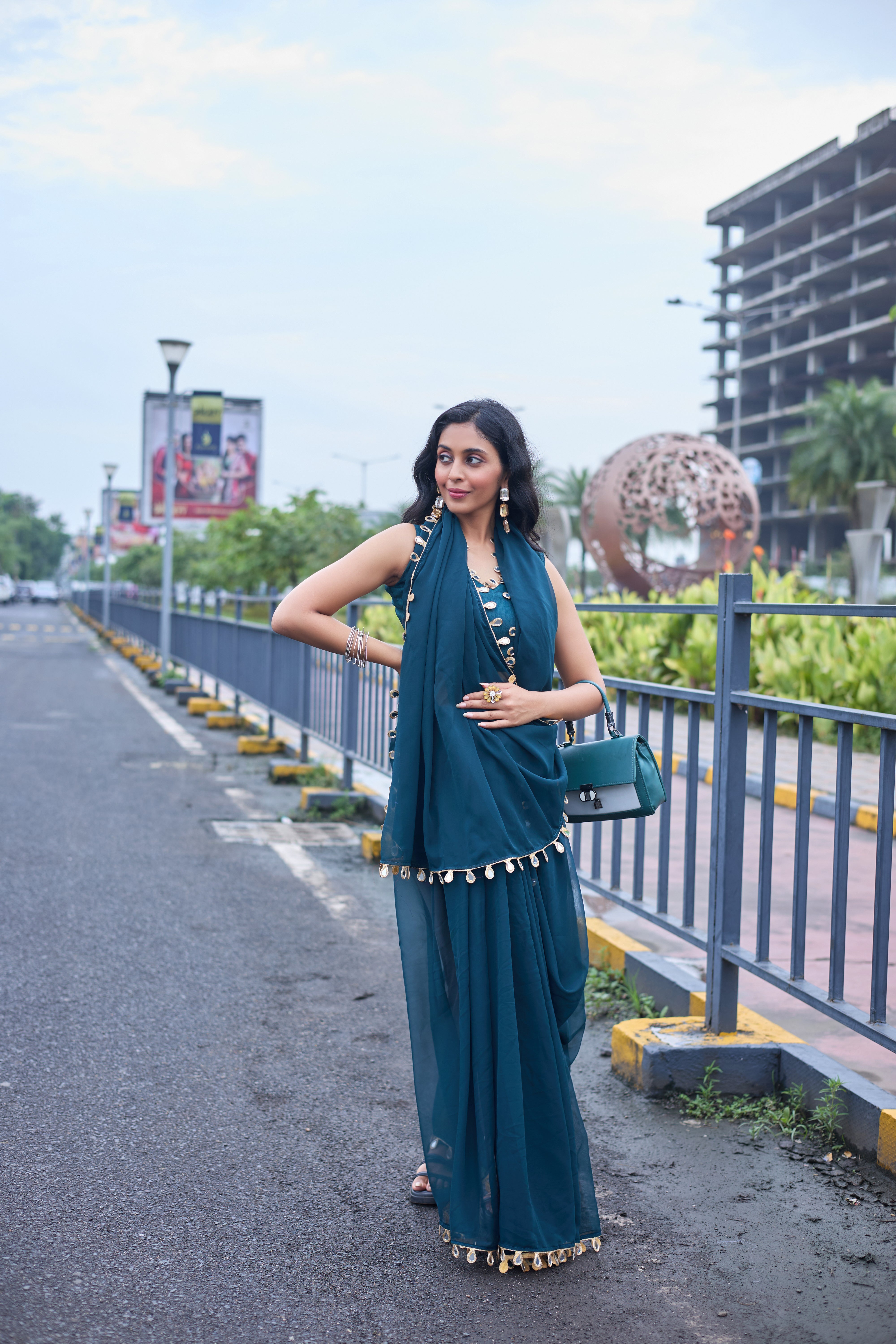 Designer Teal Georgette Saree with Gold Coin Border