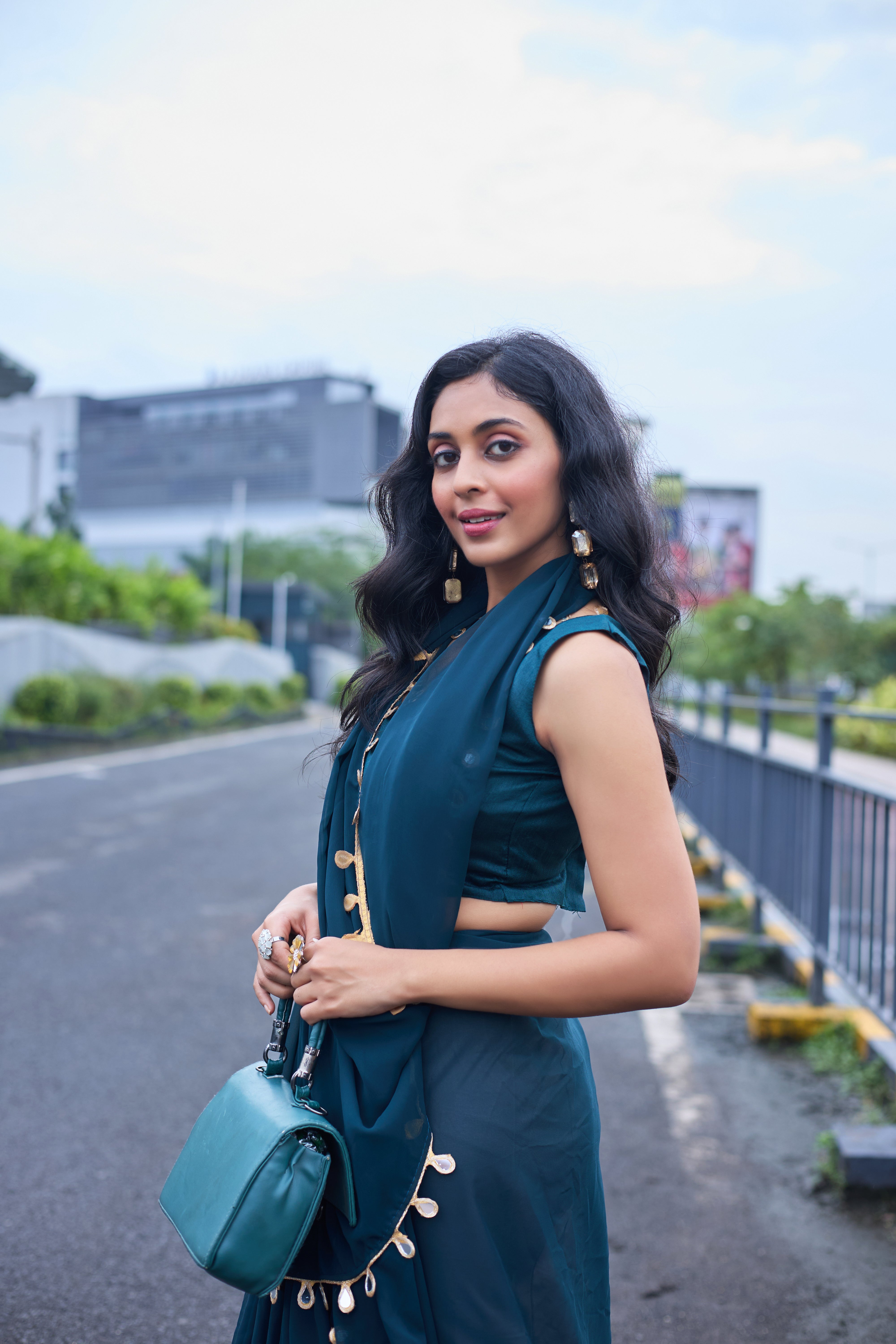 Designer Teal Georgette Saree with Gold Coin Border