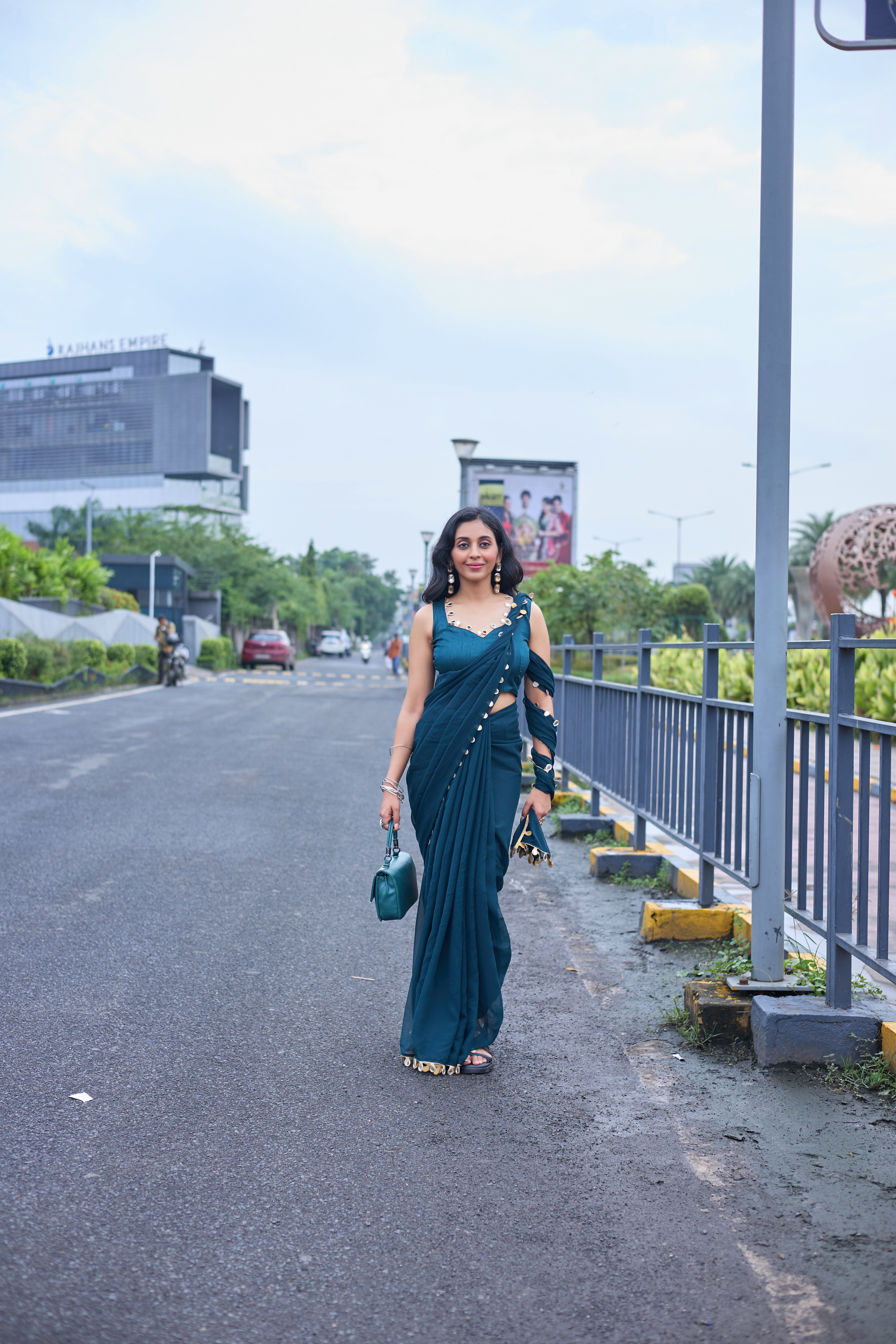 Designer Teal Georgette Saree with Gold Coin Border