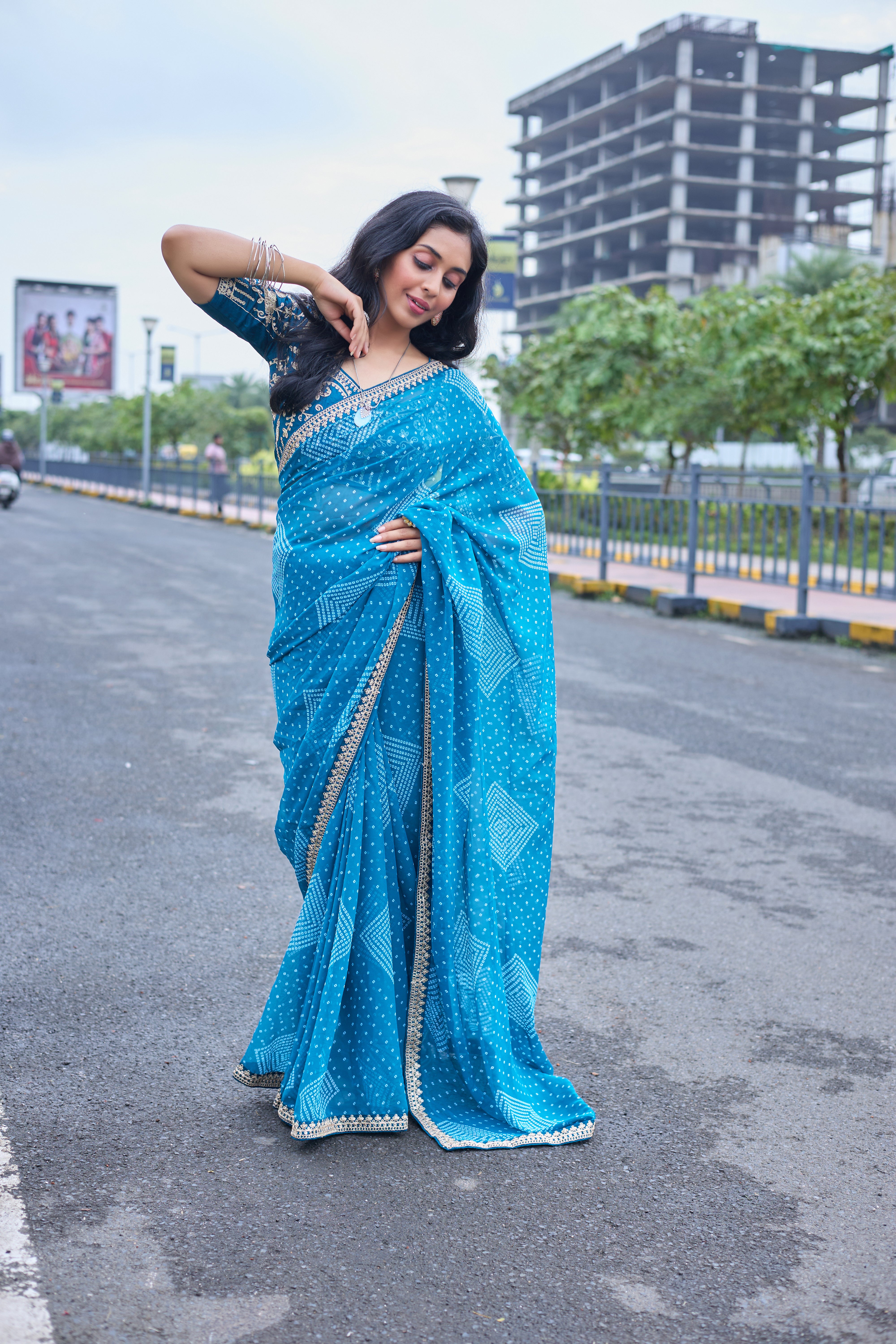 Azure Blue Bandhani Georgette Saree with Embellished Border