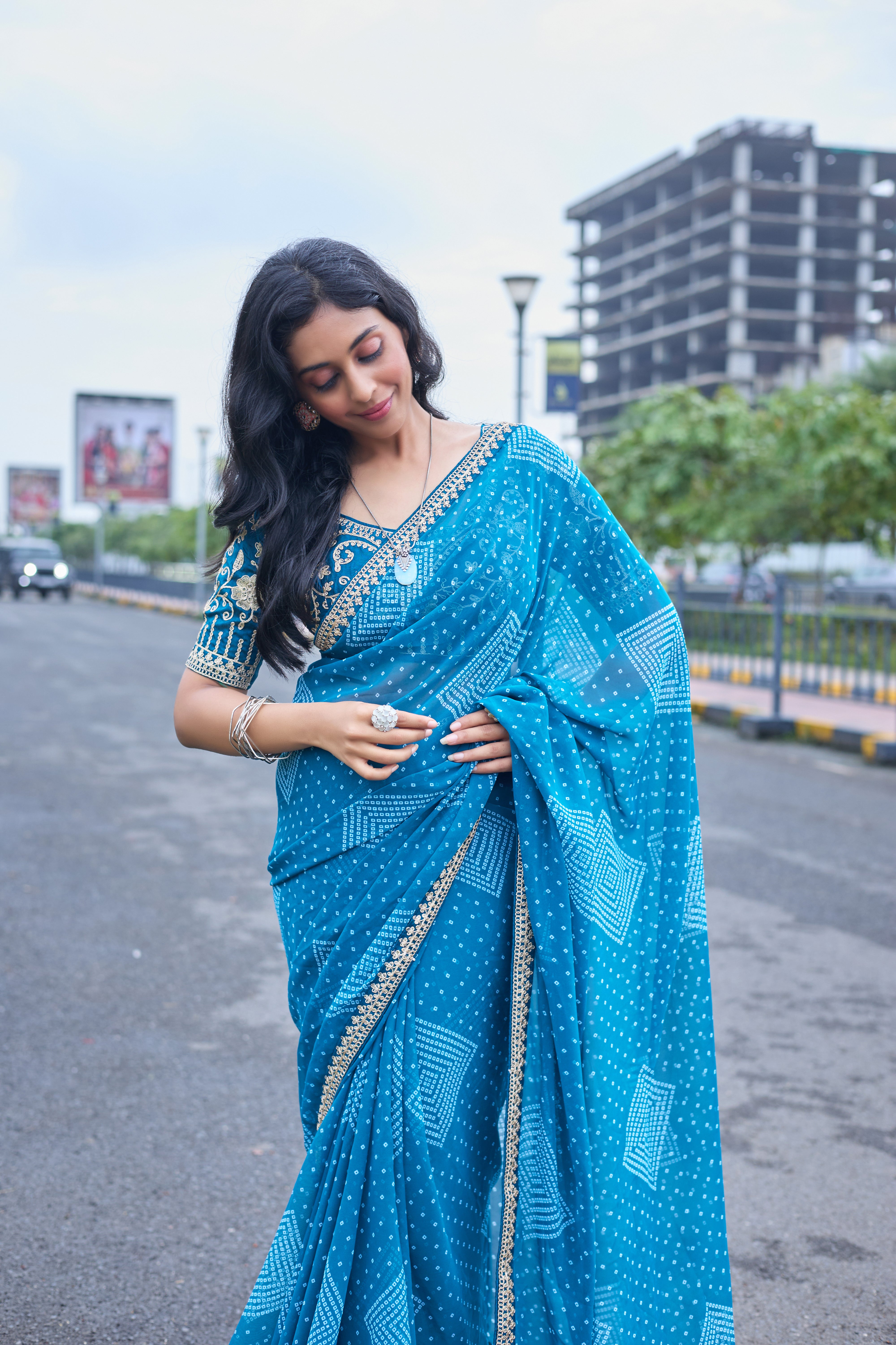Azure Blue Bandhani Georgette Saree with Embellished Border