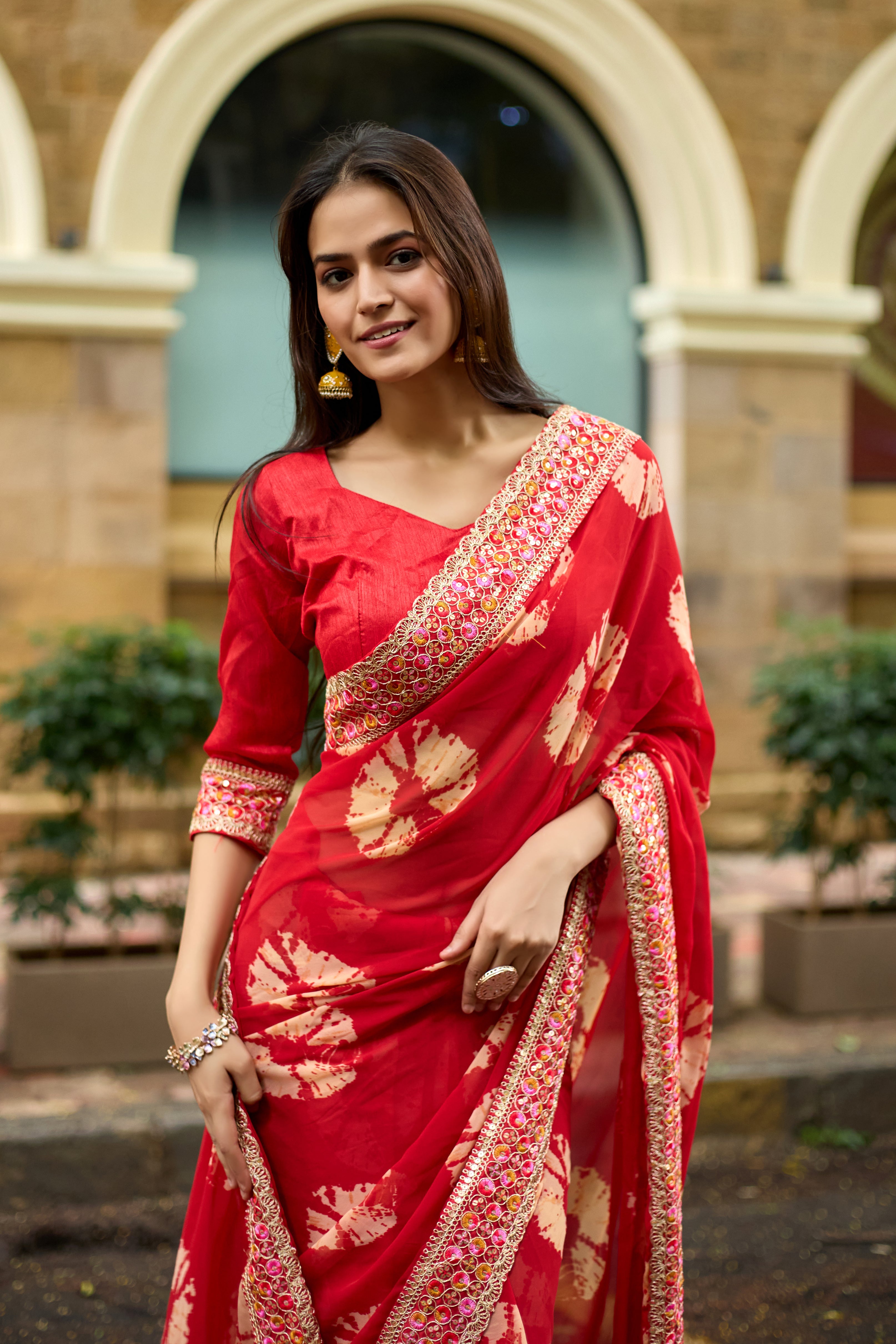 Vibrant Red Batik Georgette Saree with Embroidered Border