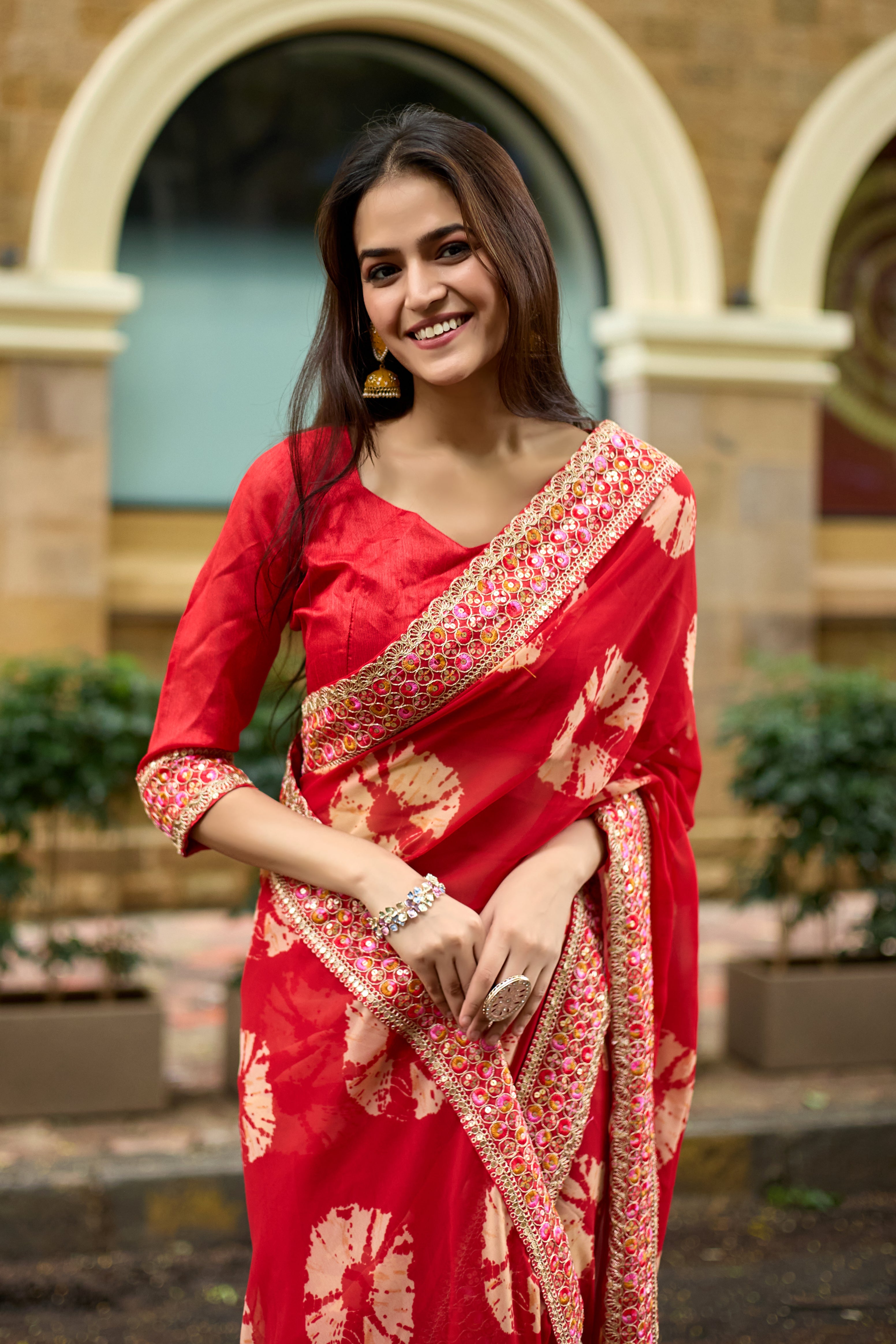 Vibrant Red Batik Georgette Saree with Embroidered Border