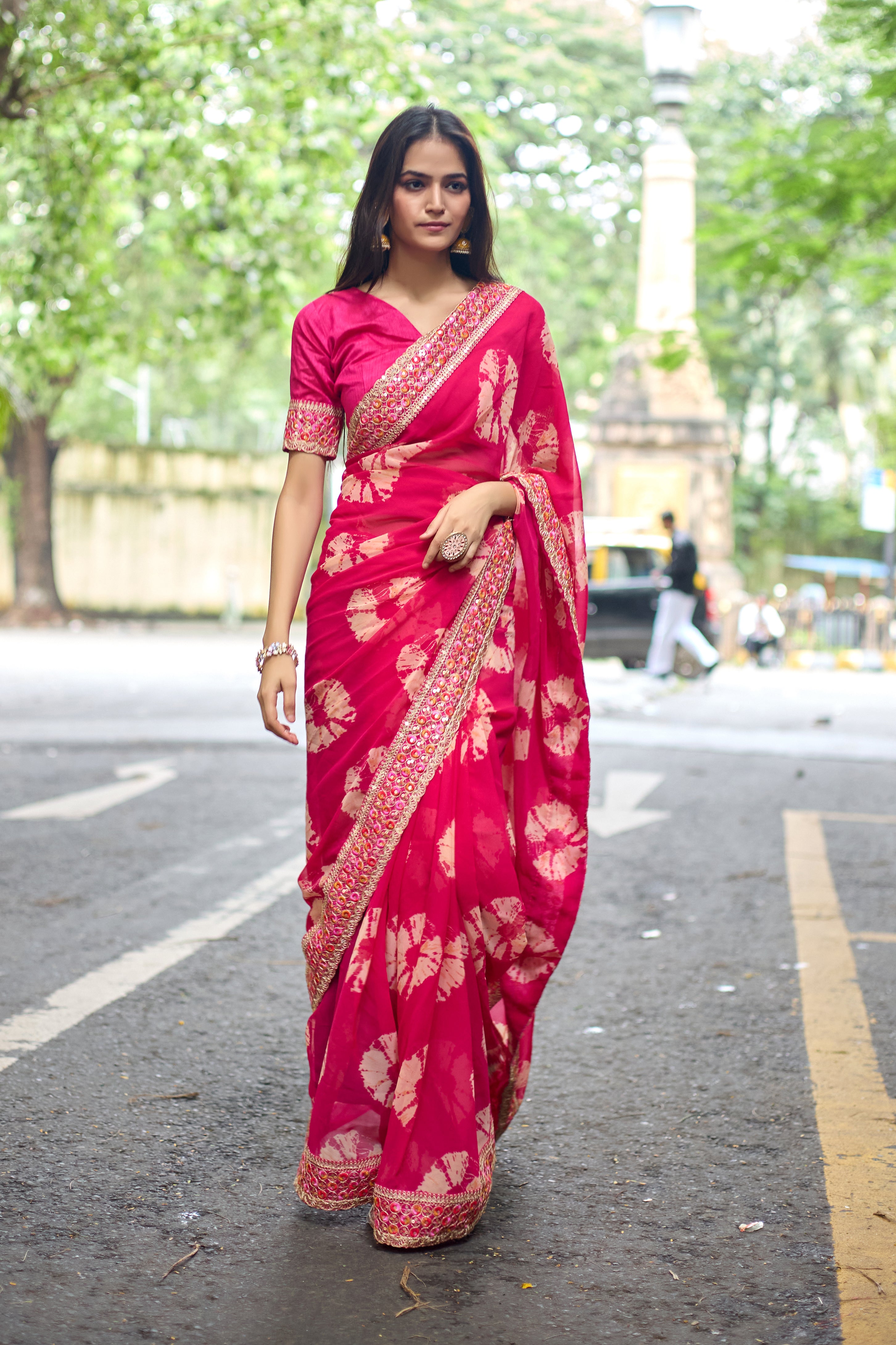 Vibrant Pink Batik Georgette Saree with Embroidered Border