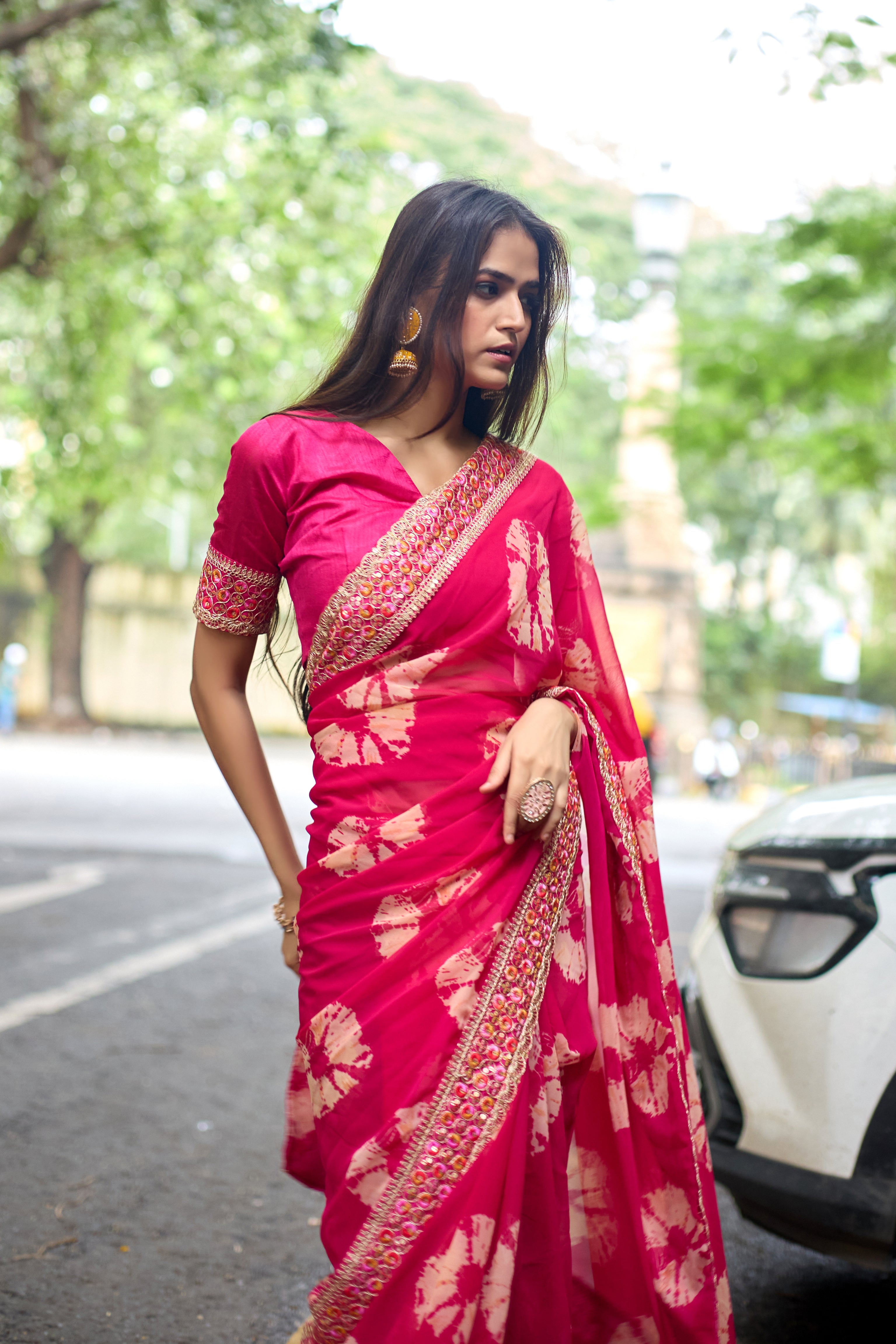 Vibrant Pink Batik Georgette Saree with Embroidered Border