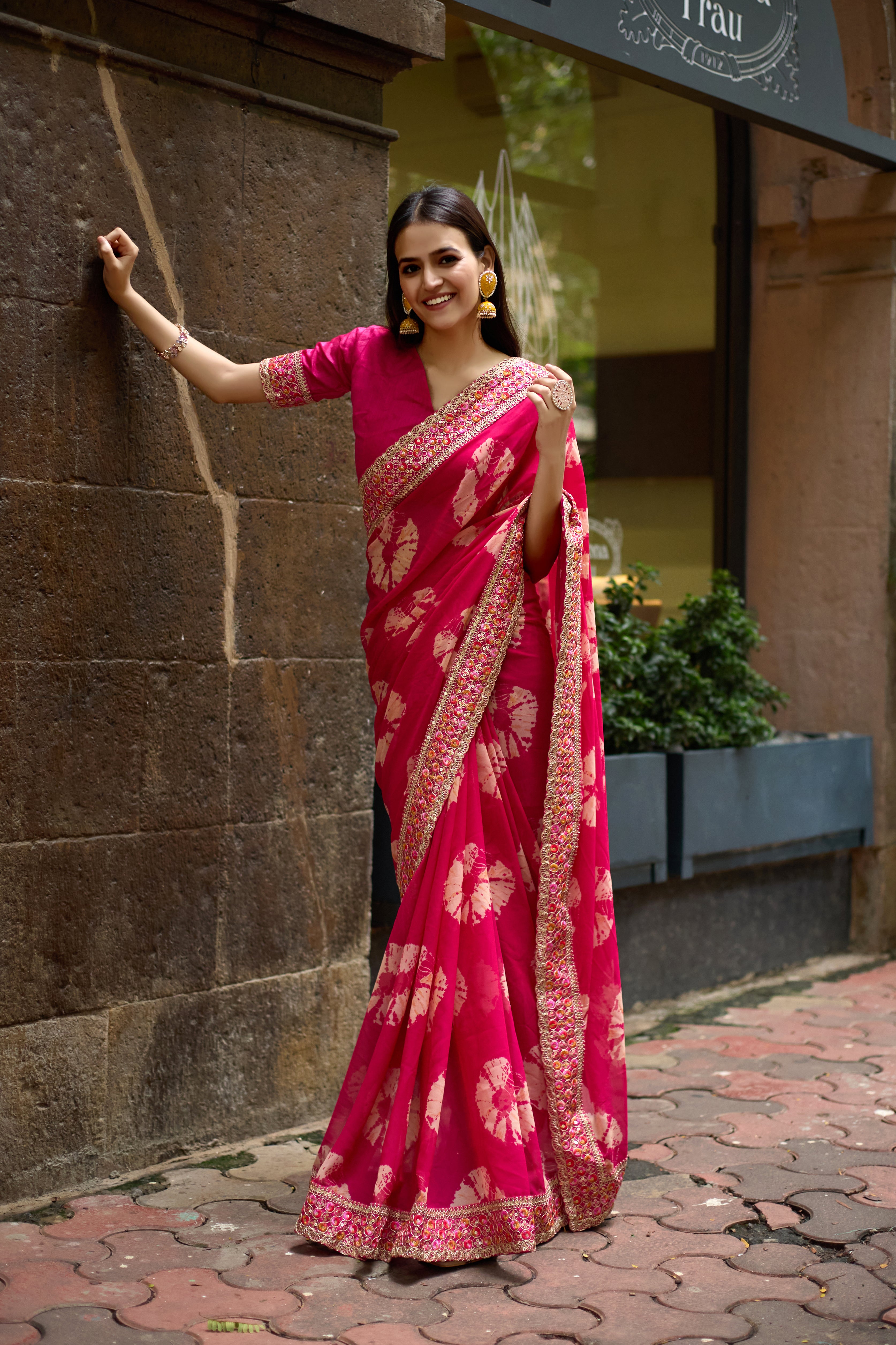 Vibrant Pink Batik Georgette Saree with Embroidered Border