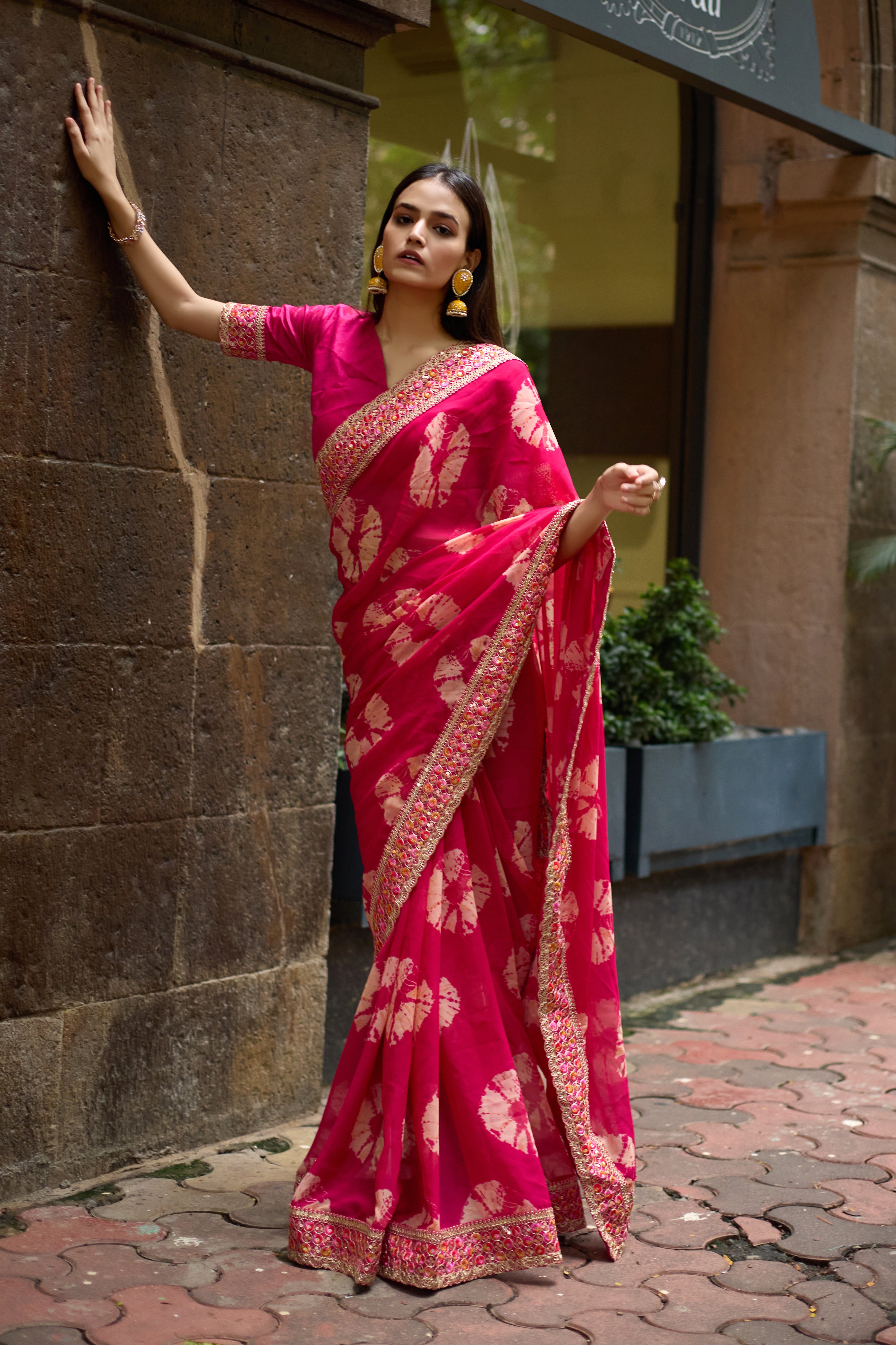 Vibrant Pink Batik Georgette Saree with Embroidered Border