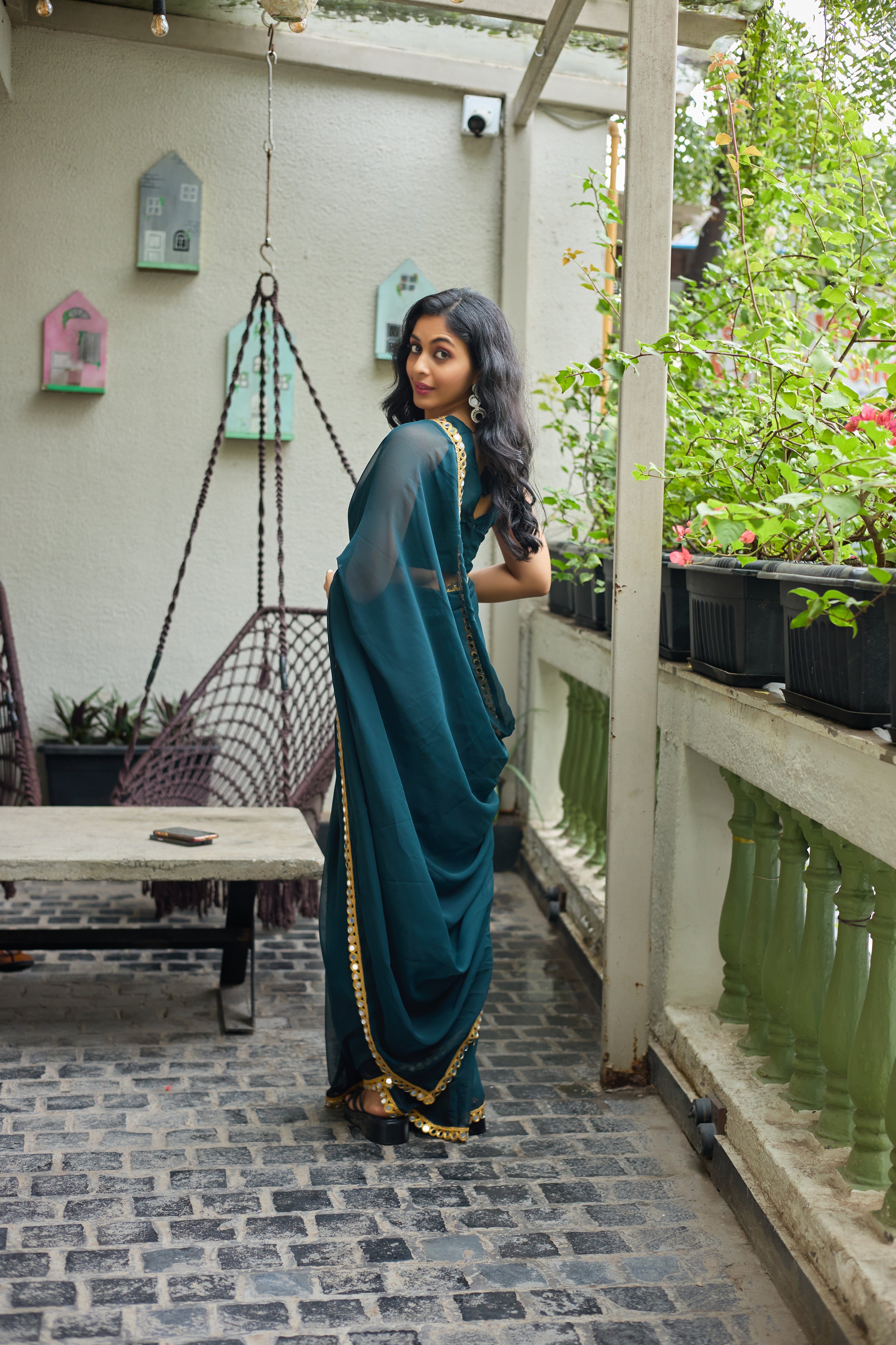 Teal Charm Georgette Saree with Golden Mirror Work Border