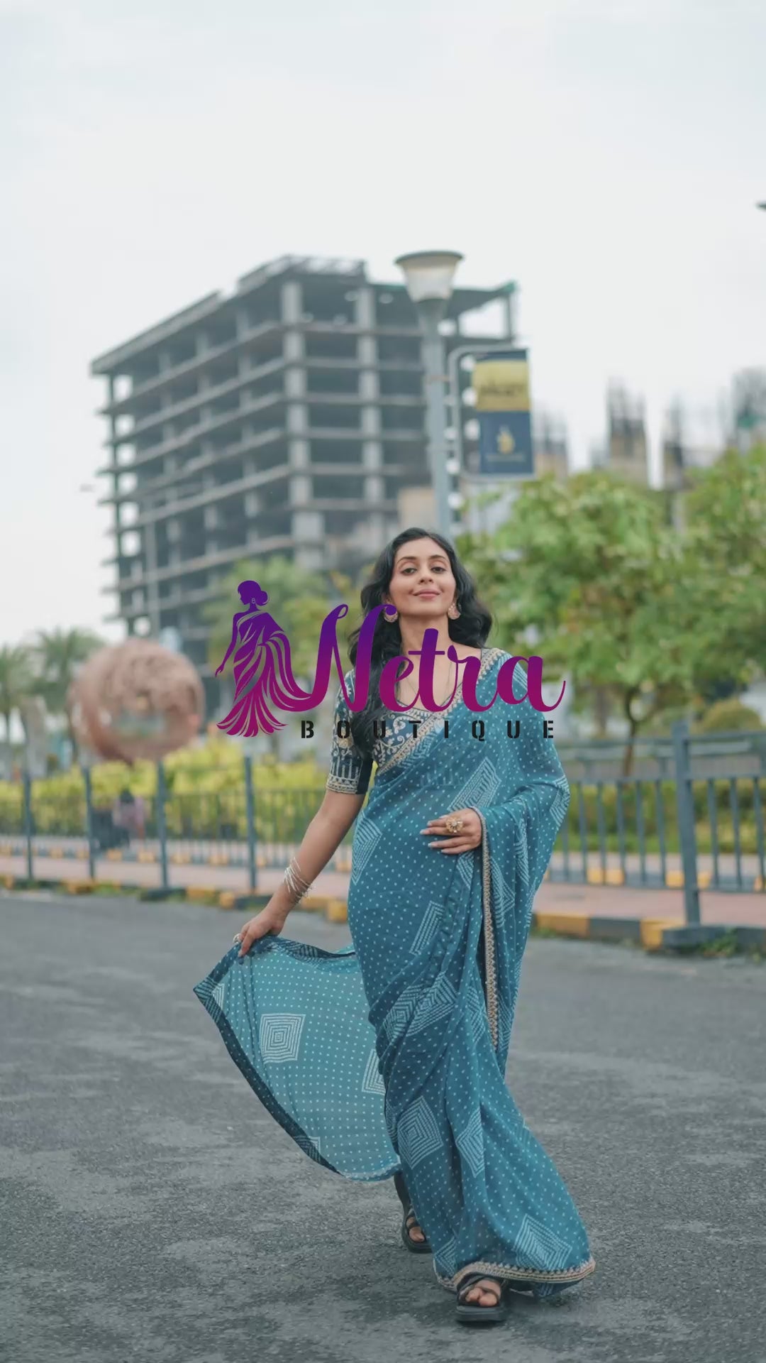 Azure Blue Bandhani Georgette Saree with Embellished Border